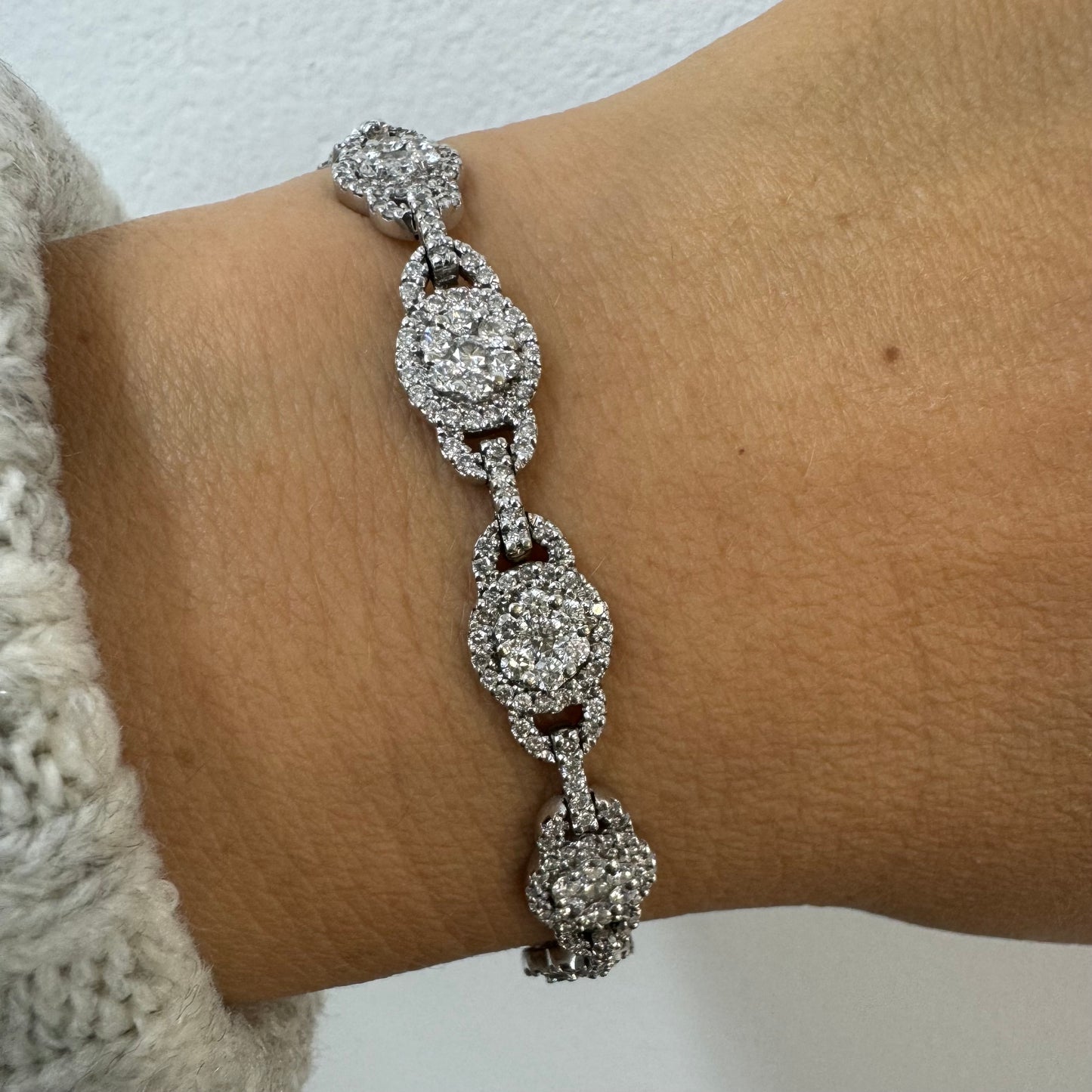 14K gold Tennis bracelet set rows of sparkling Diamonds in a dazzling halo design