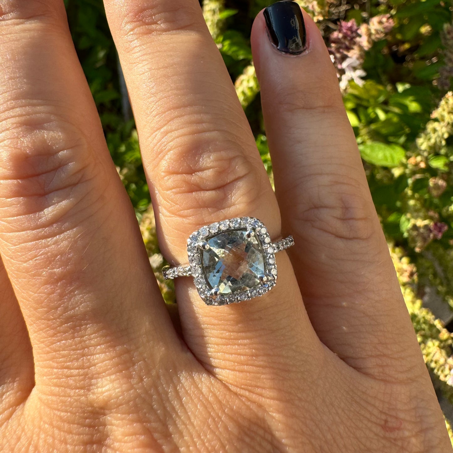 14K white gold ring set with a large prasiolite center stone & diamonds.