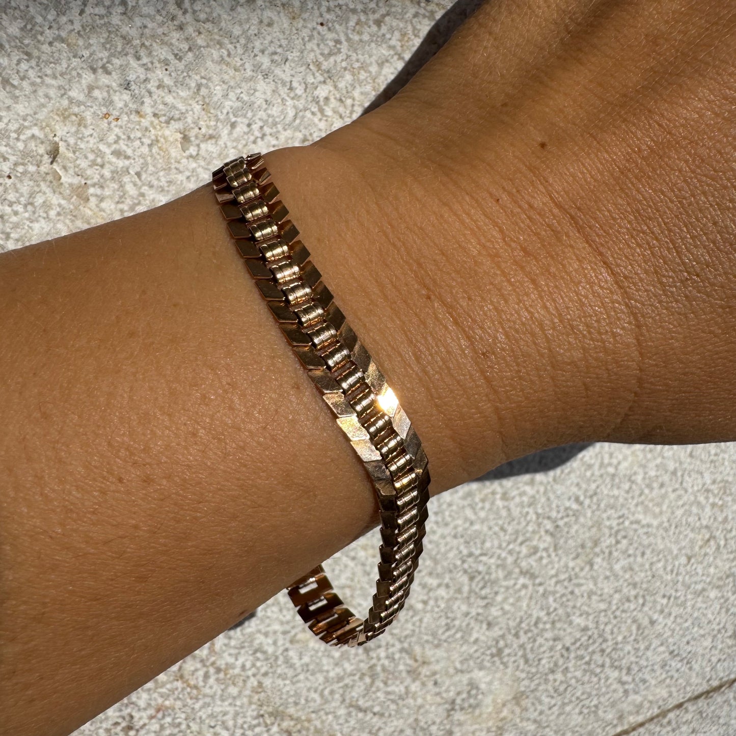 14K gold bracelet with a bold, flexible link design and a secure box clasp.