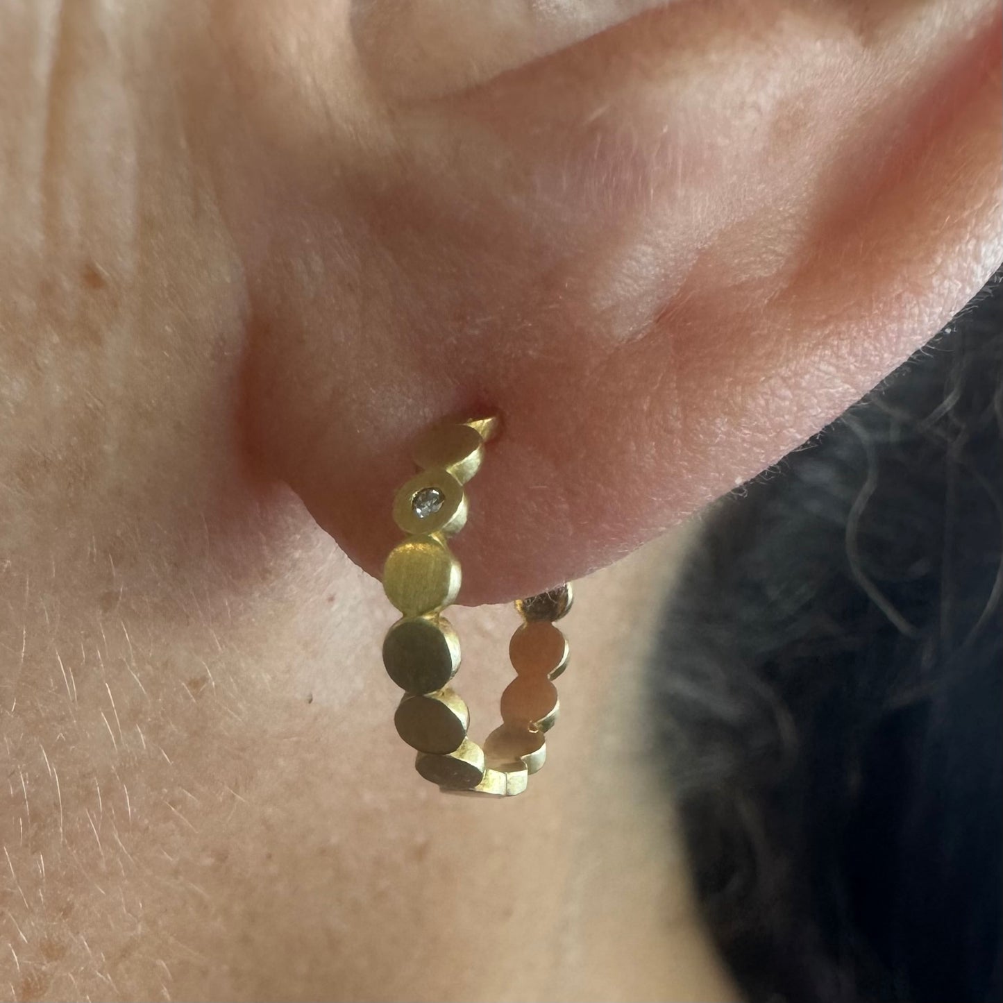 18K gold “H.Stern” hoop earrings set with one Diamond