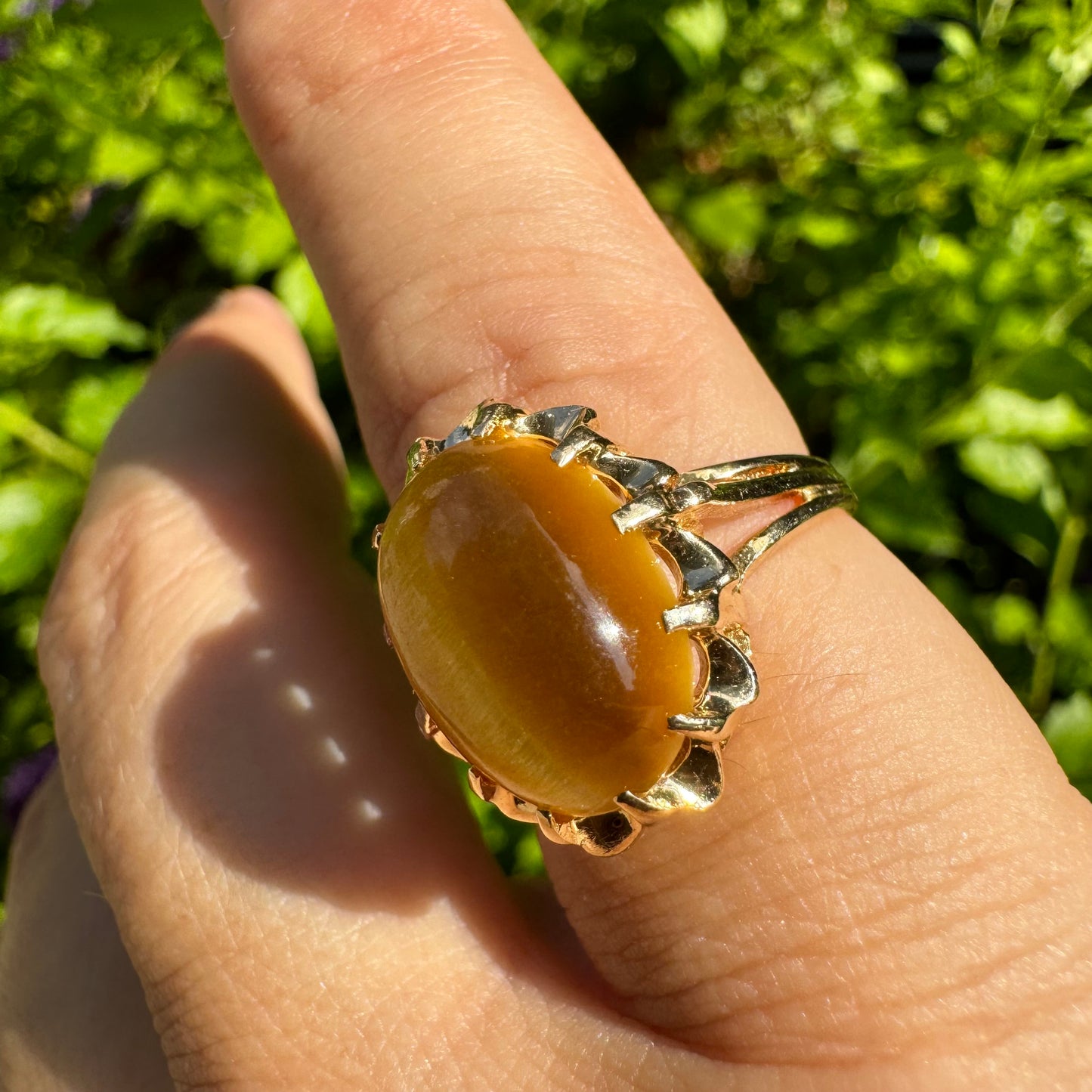 14K gold ring set with a yellow Cat’s Eye cabochon