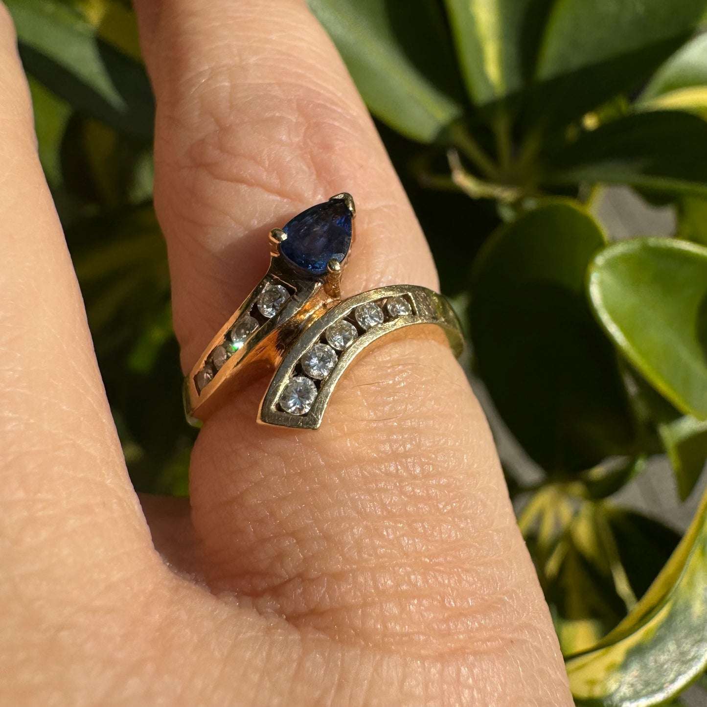 14K gold ring set with a teardrop-shaped Sapphire & Diamonds