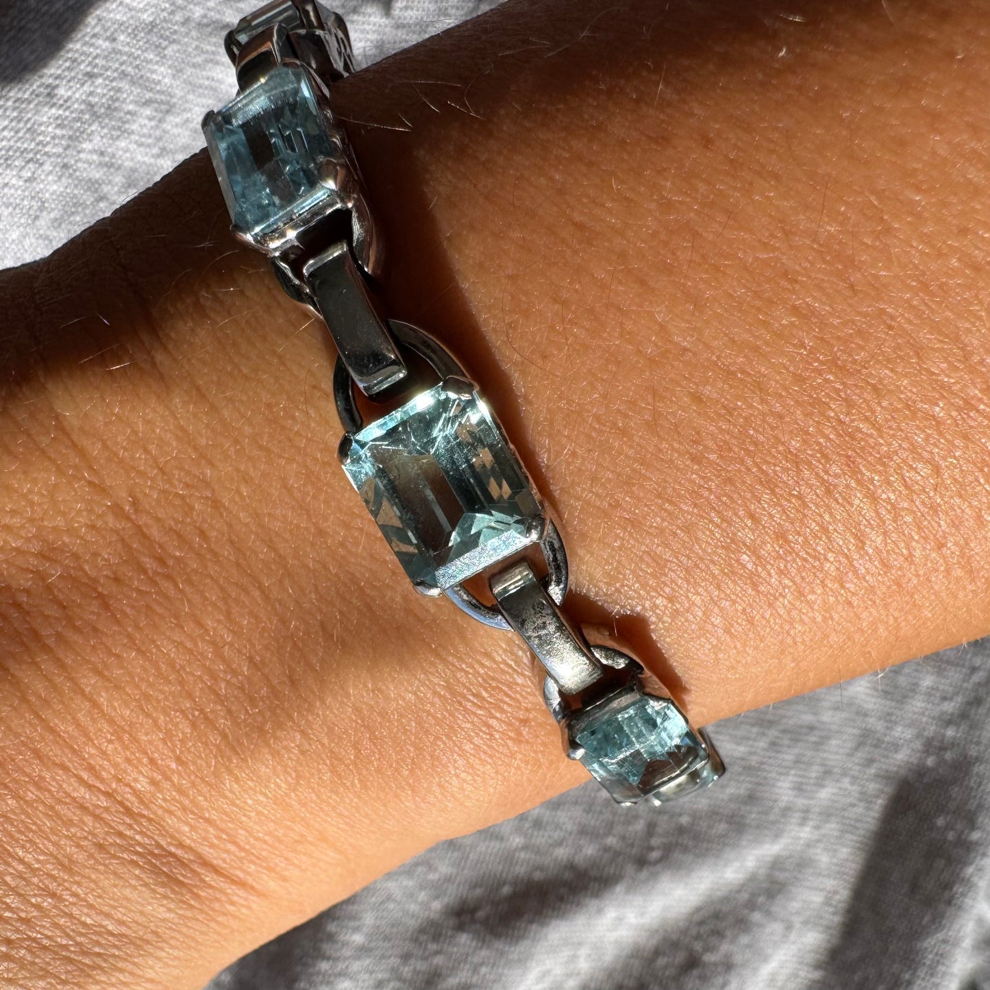 18K white gold bracelet set with large emerald-cut Aquamarine stones — elegant, radiant, and timeless.