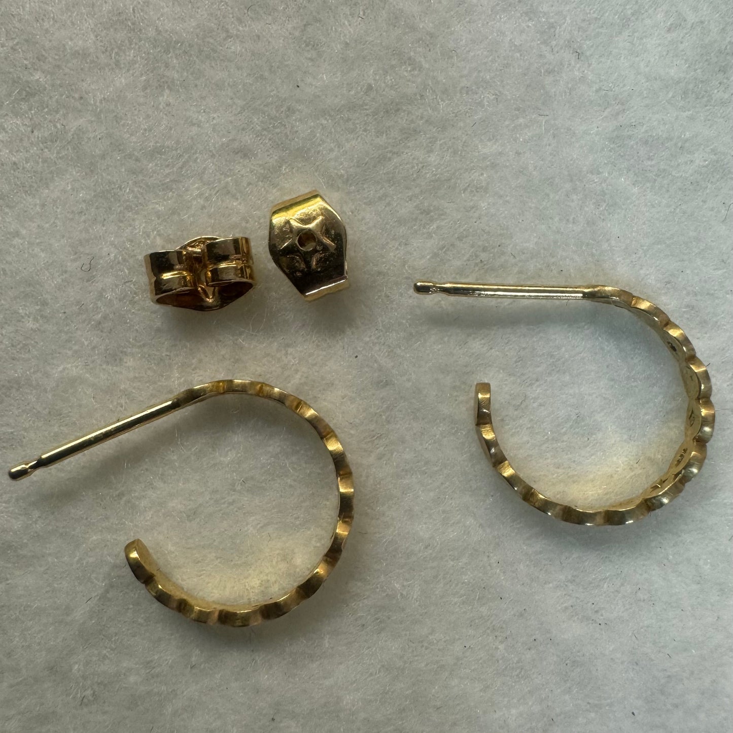18K gold “H.Stern” hoop earrings set with one Diamond