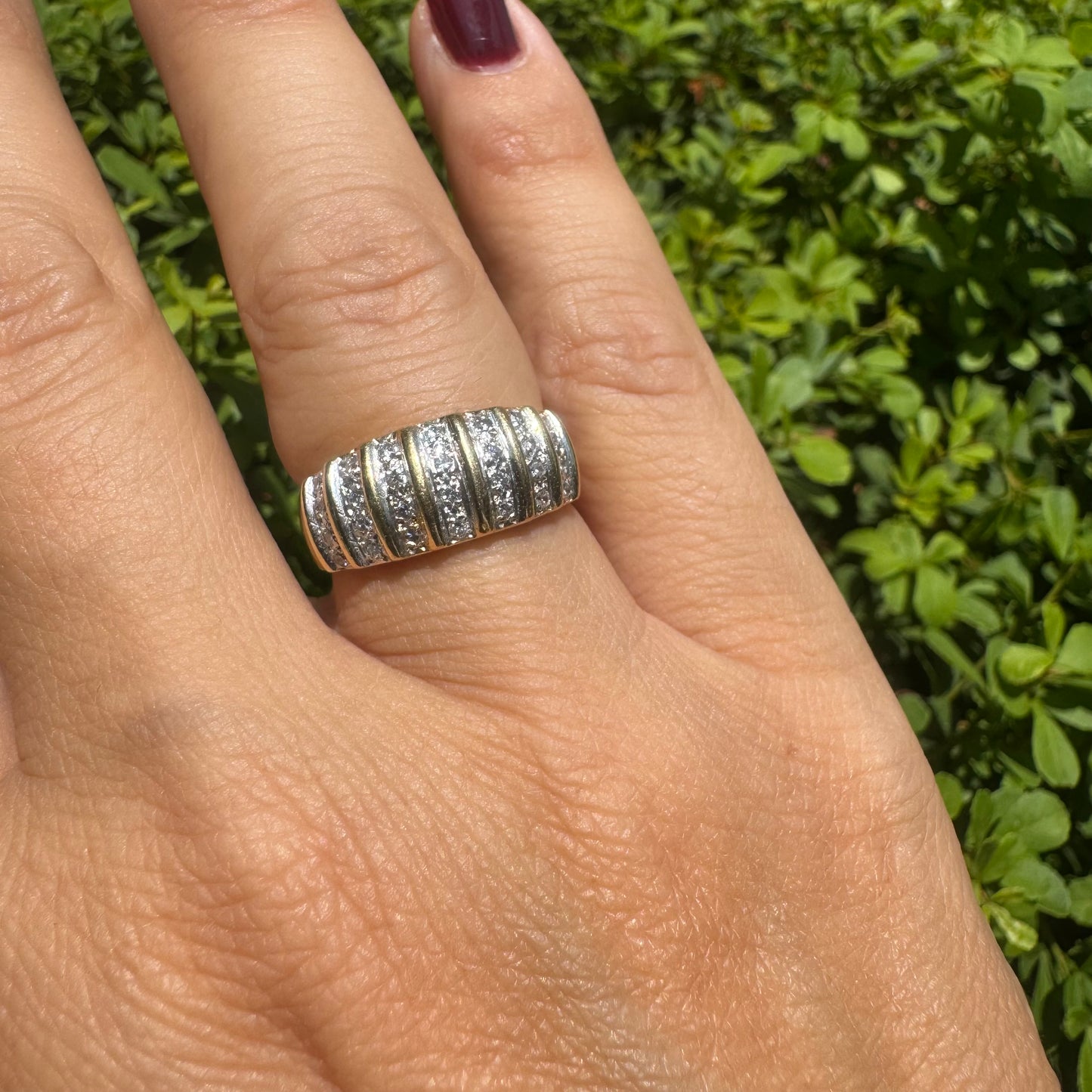 18K gold ring featuring multiple horizontal rows of sparkling Diamonds.
