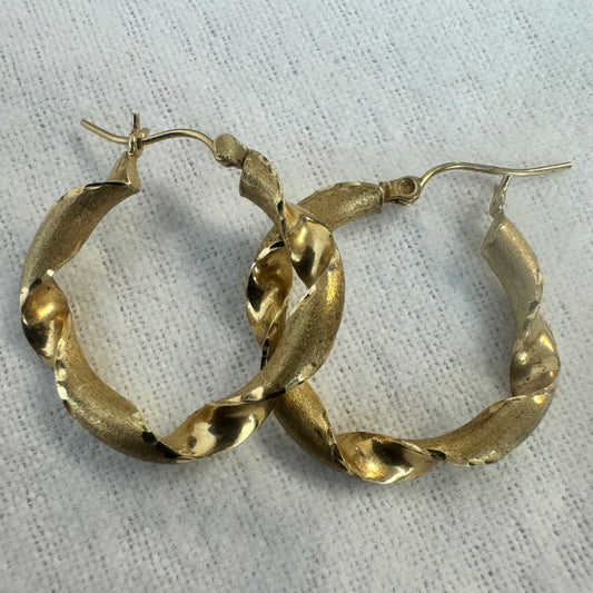 14K gold twisted hoop earrings with a combination of polished and matte finishes