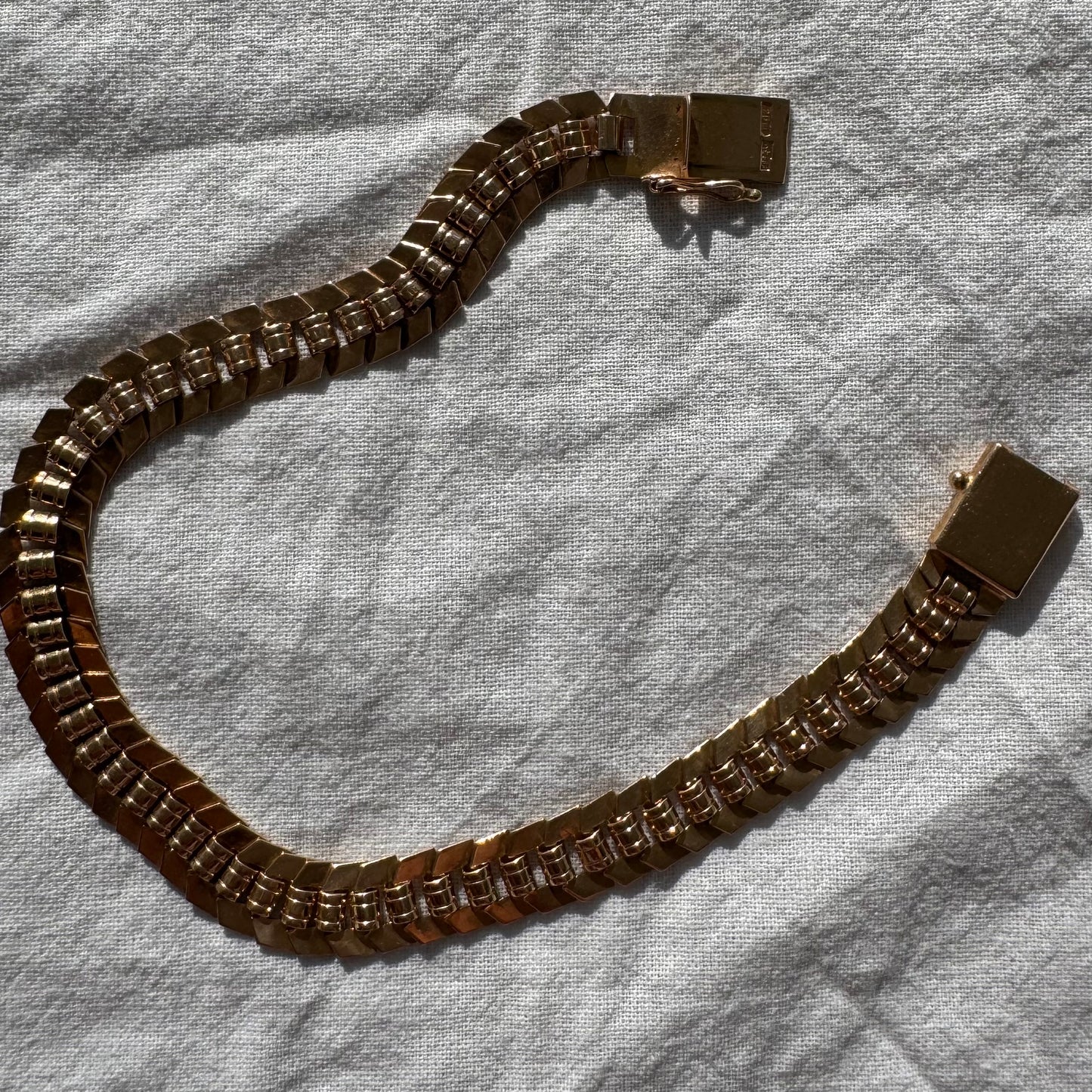 14K gold bracelet with a bold, flexible link design and a secure box clasp.