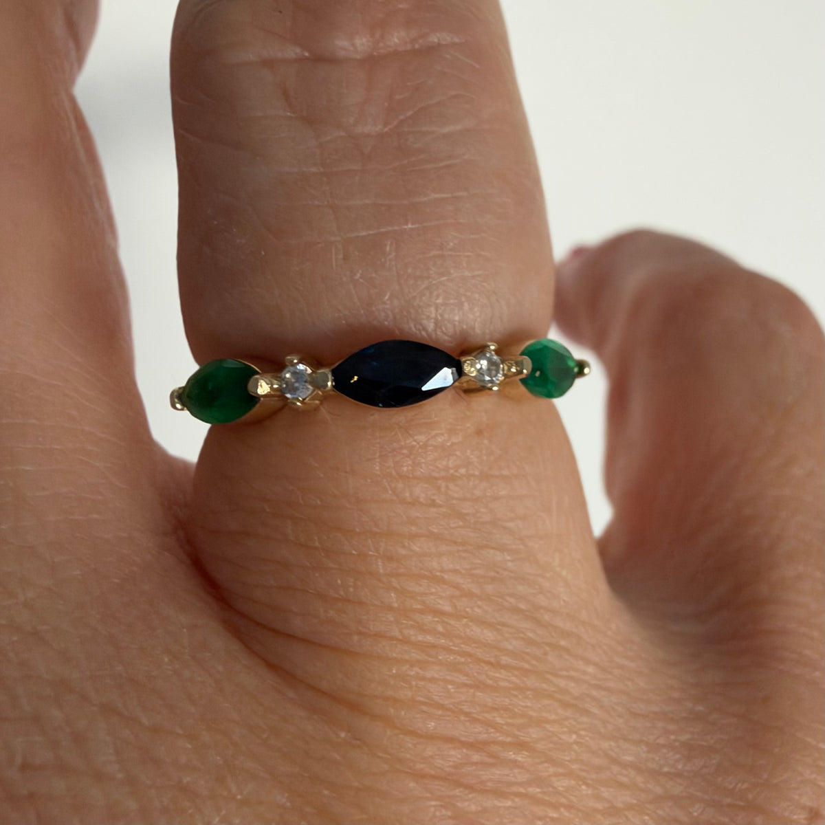 14K yellow gold vintage ring with a marquise-cut sapphire and emeralds