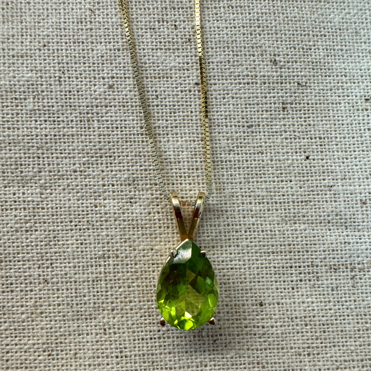14K gold necklace set with a pear-shaped Peridot
