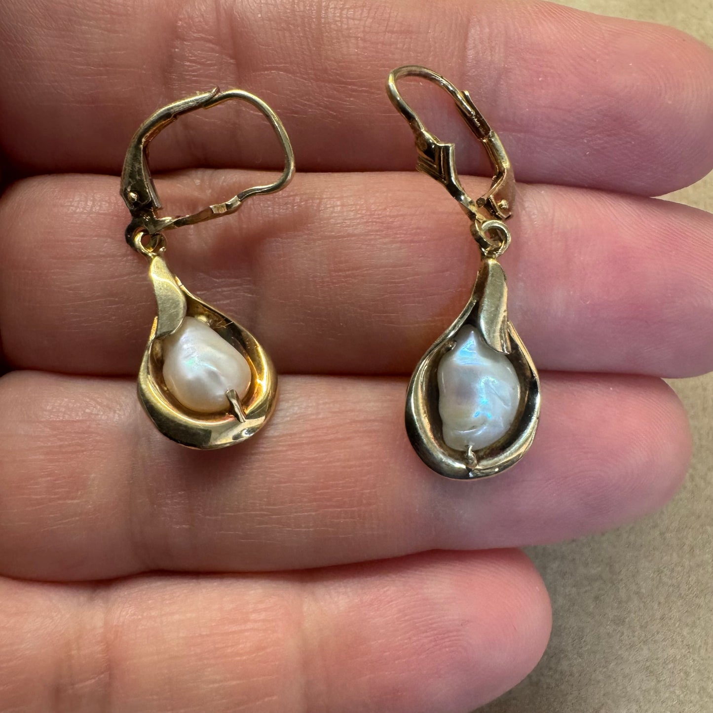 14K gold drop earrings featuring baroque Pearls set in fluid, organic shape