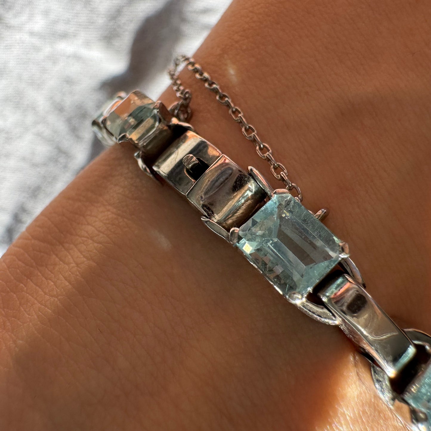 18K white gold bracelet set with large emerald-cut Aquamarine stones — elegant, radiant, and timeless.