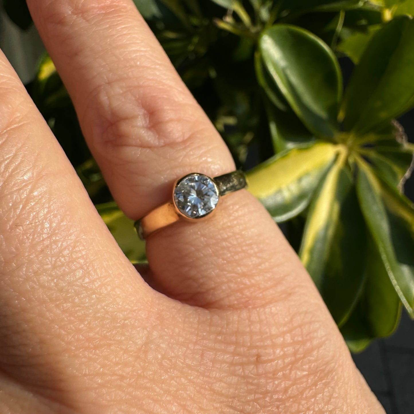 14K gold ring set with one center Diamond