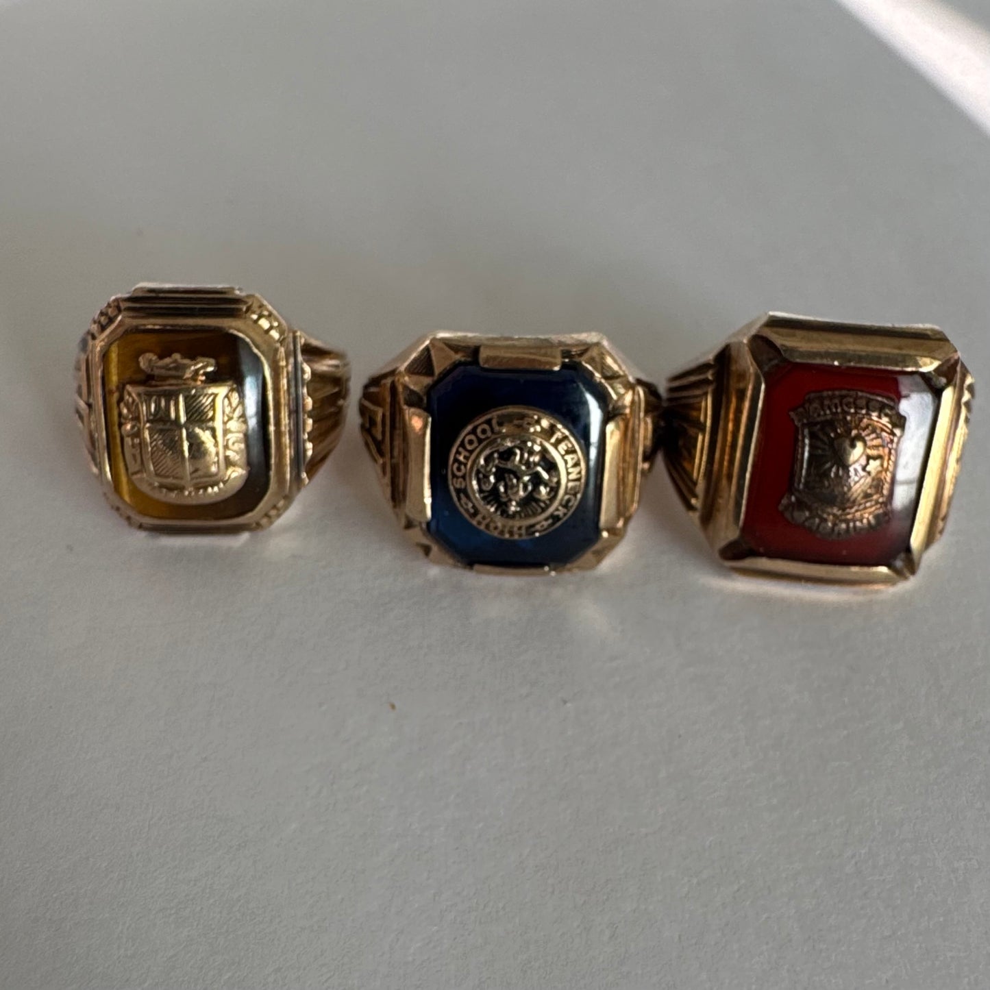 10K gold signet-style ring featuring a deep blue stone set with a raised “School & Teamwork” emblem at the center.