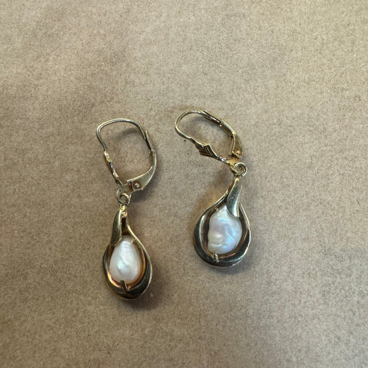 14K gold drop earrings featuring baroque Pearls set in fluid, organic shape