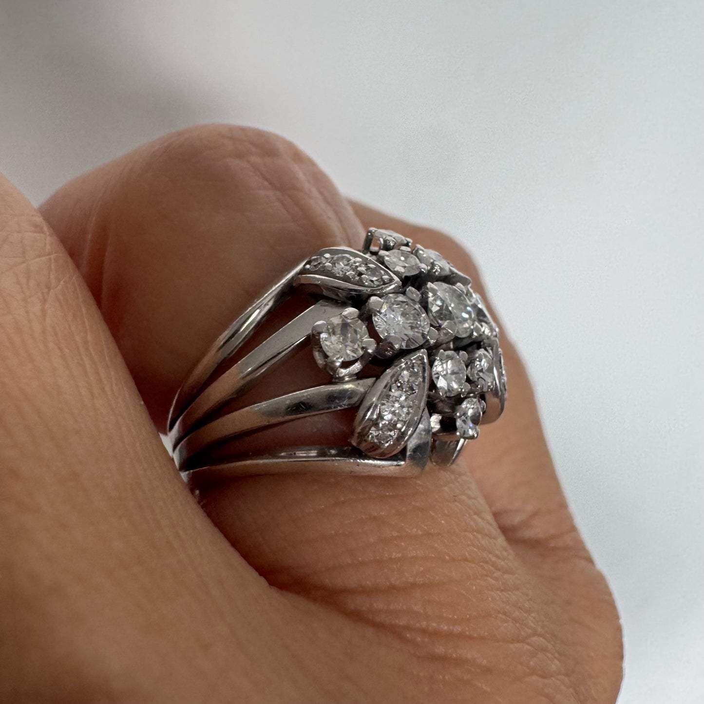 Platinum ring set with Diamonds in a bold, multi-layered floral design.