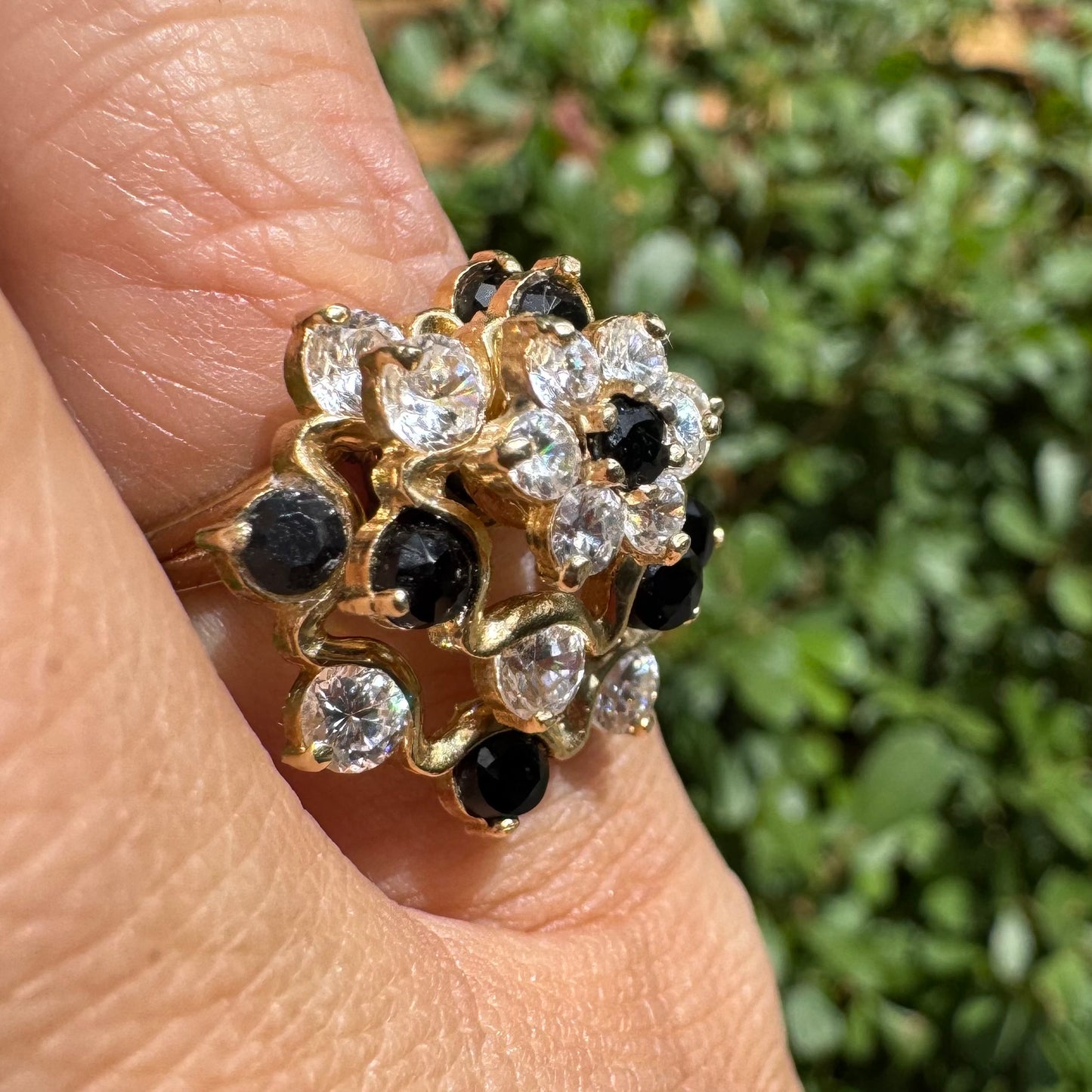 14K gold kinetic cocktail ring set with black and transparent stones