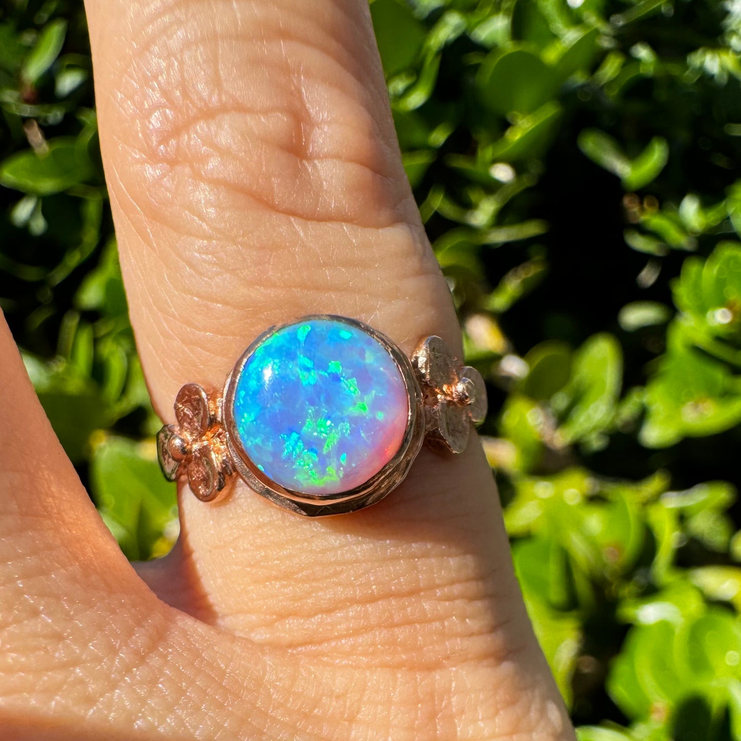 10K gold ring set with round Opal with vibrant flashes of blue, green and white