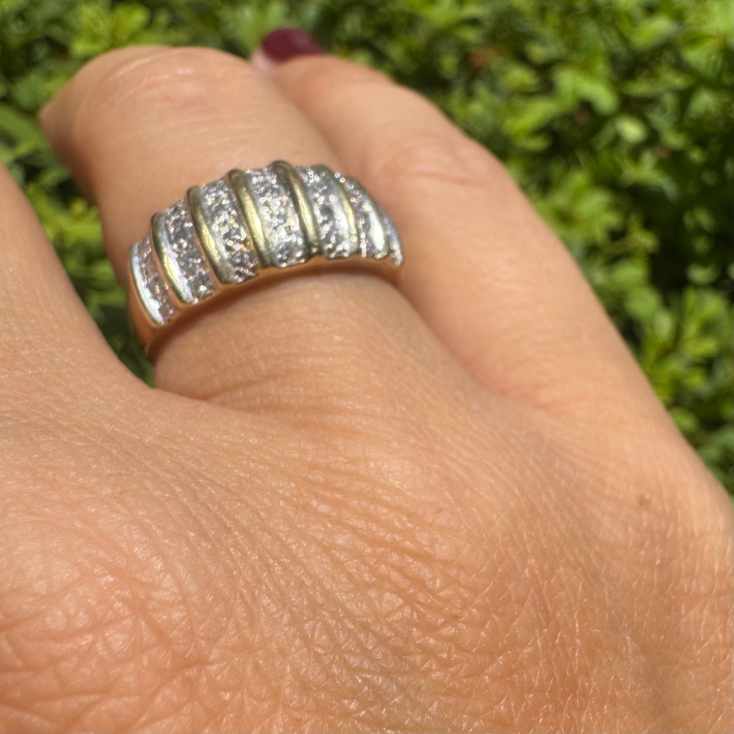 18K gold ring featuring multiple horizontal rows of sparkling Diamonds.