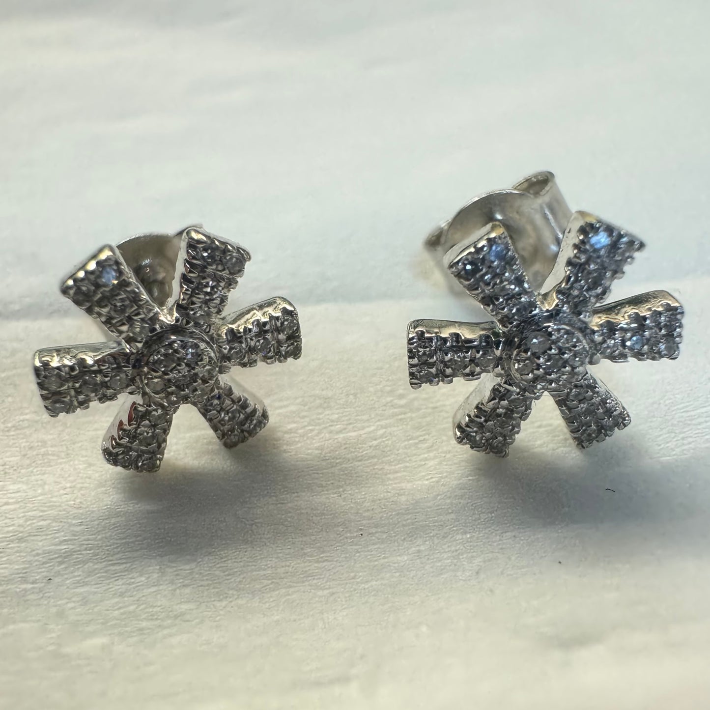 14K gold stud earrings set with Diamonds