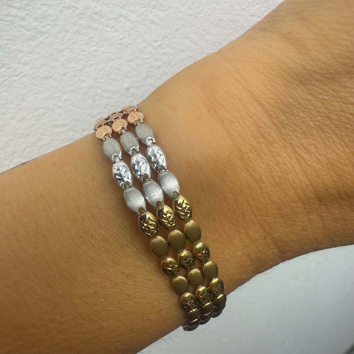 14K tri-color gold bracelet featuring yellow, white and rose gold links