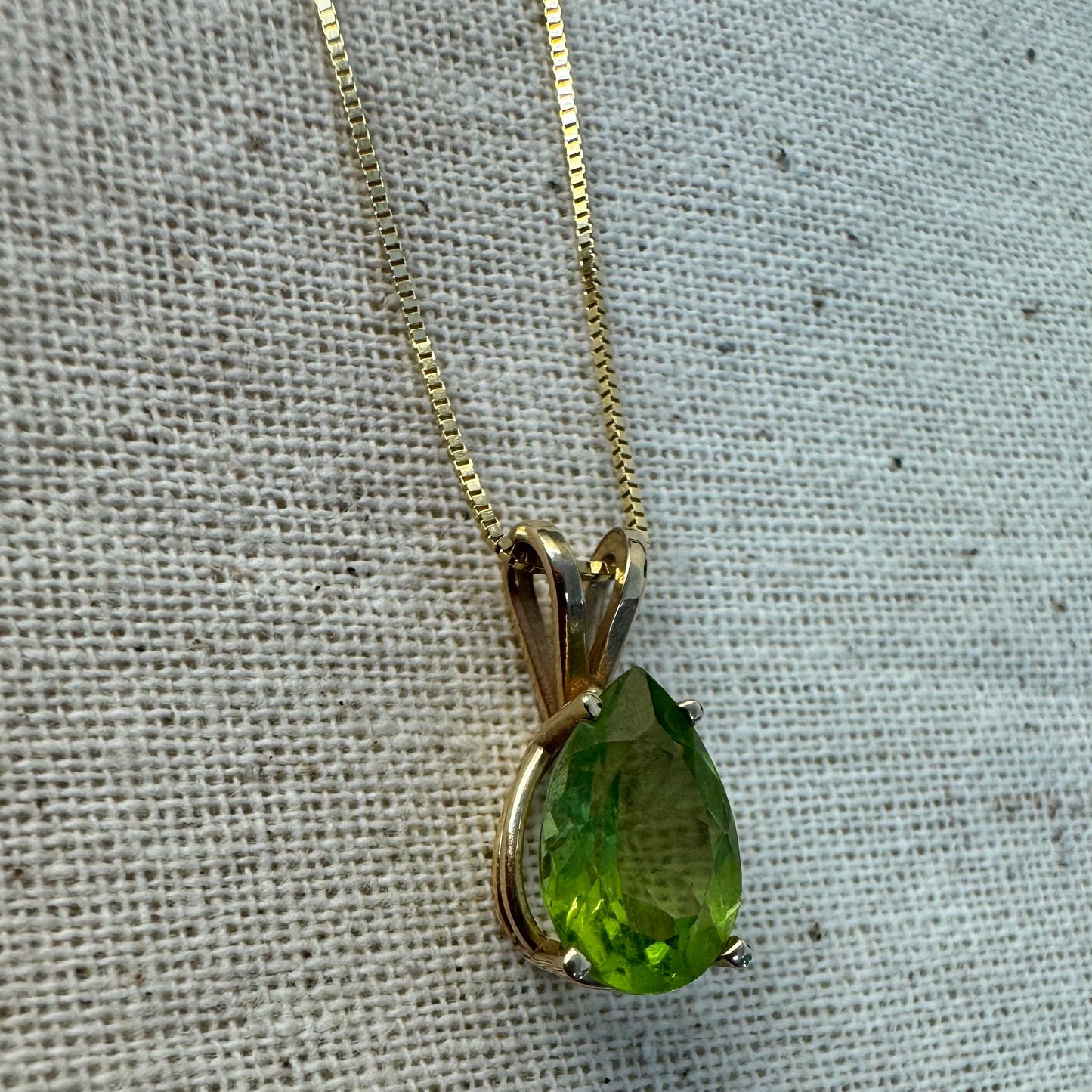 14K gold necklace set with a pear-shaped Peridot