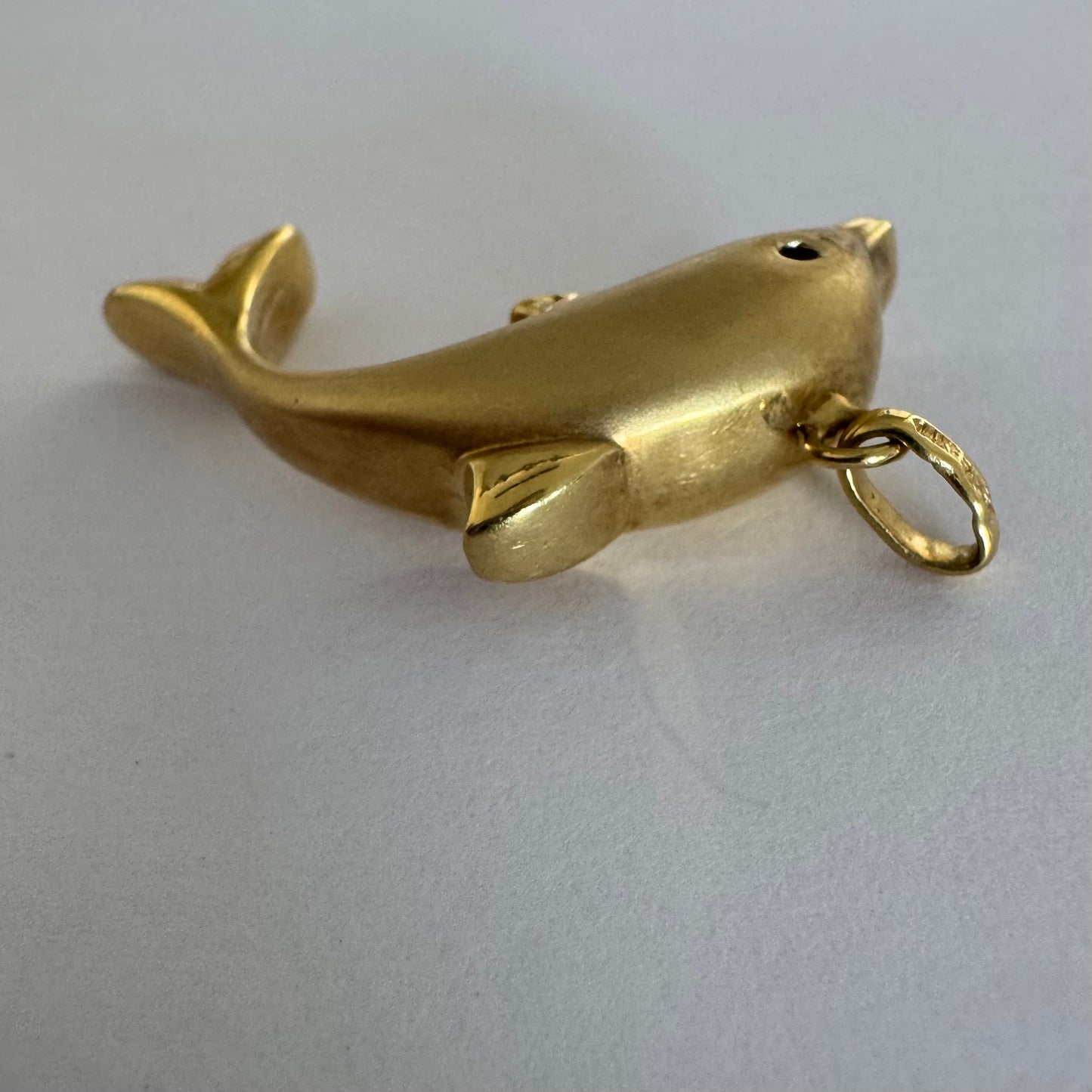 14K gold dolphin pendant with a smooth & polished finish.
