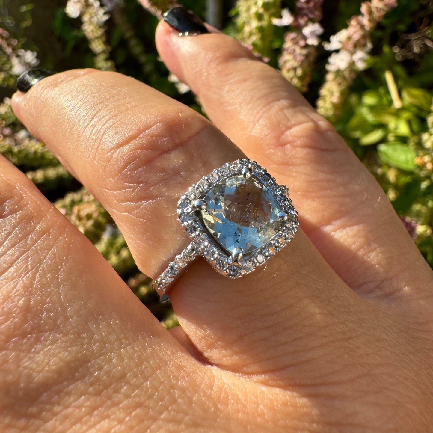 14K white gold ring set with a large prasiolite center stone & diamonds.