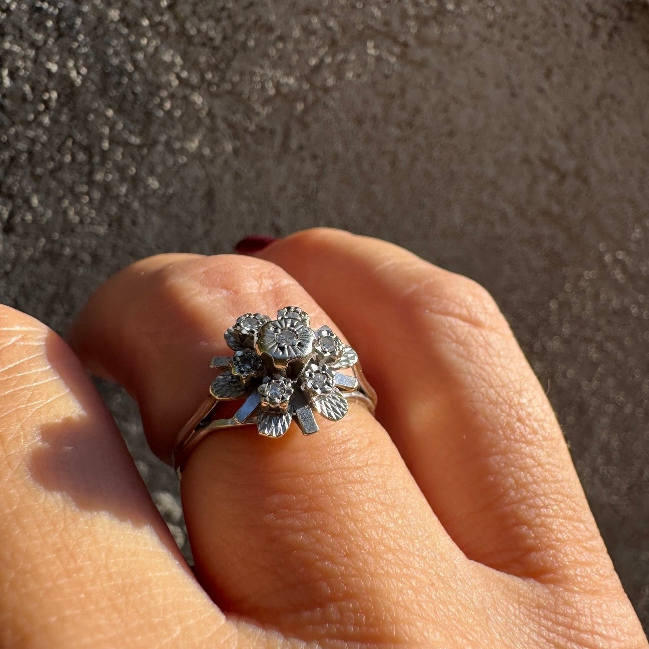 18K gold floral ring adorned with delicate diamond accents