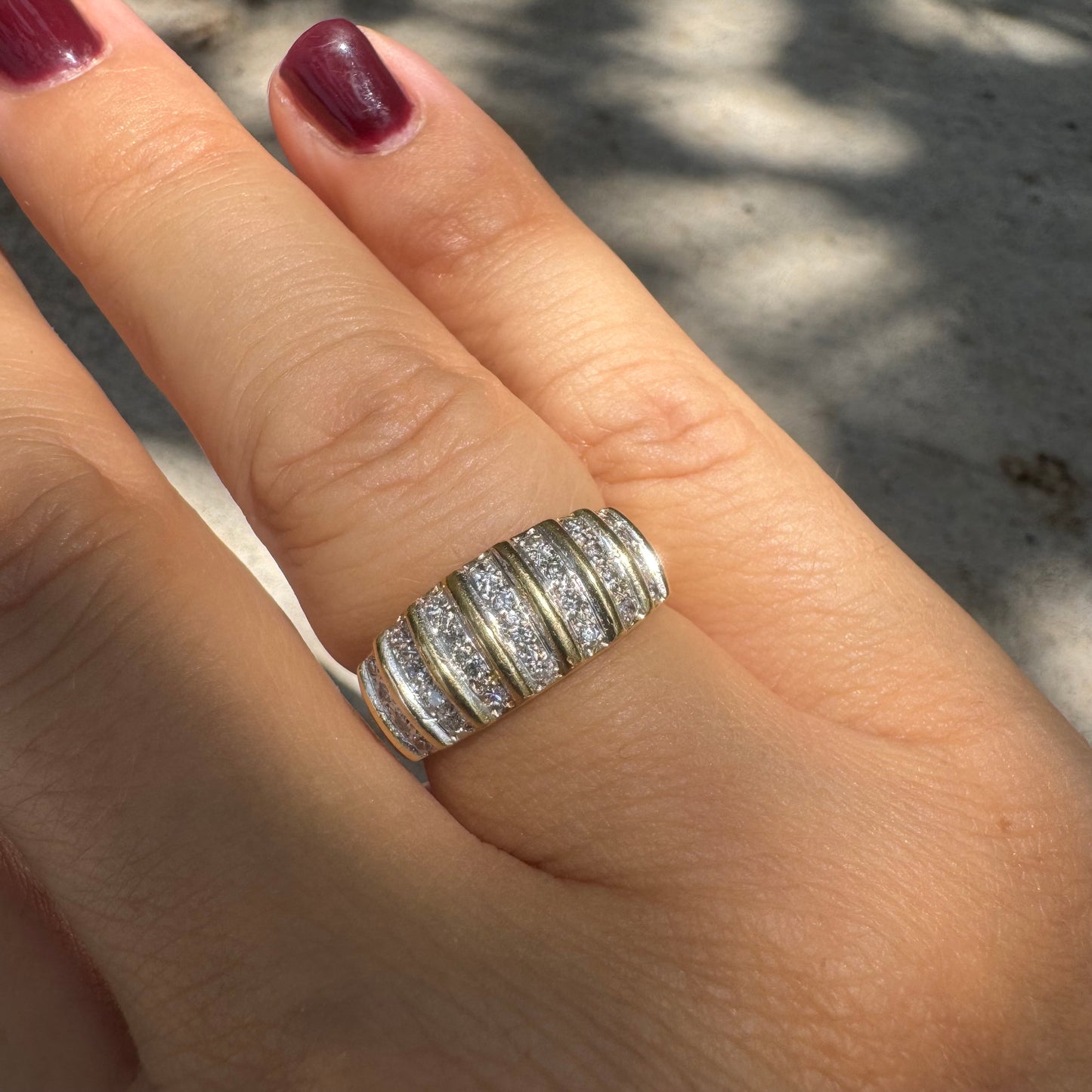 18K gold ring featuring multiple horizontal rows of sparkling Diamonds.