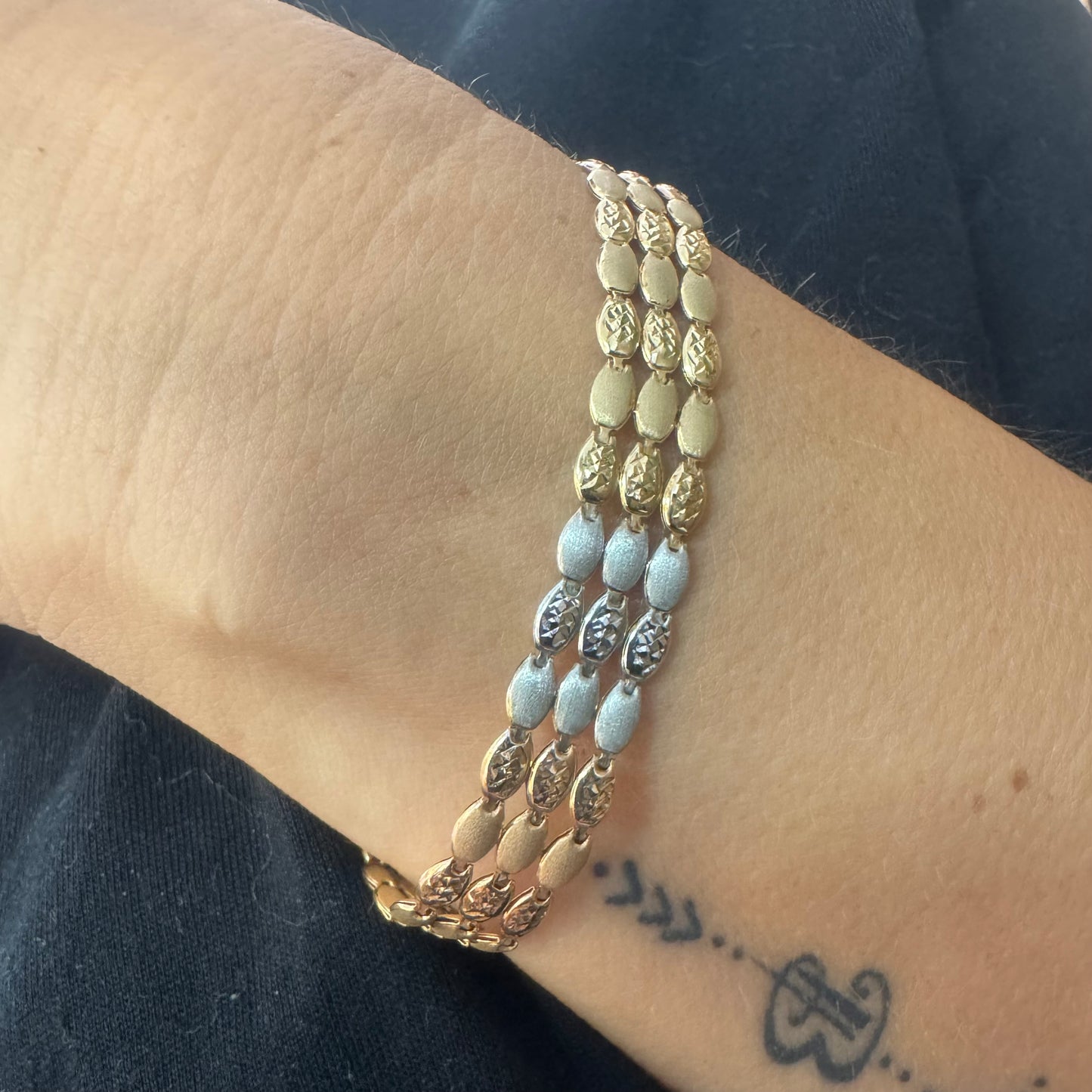 14K tri-color gold bracelet featuring yellow, white and rose gold links
