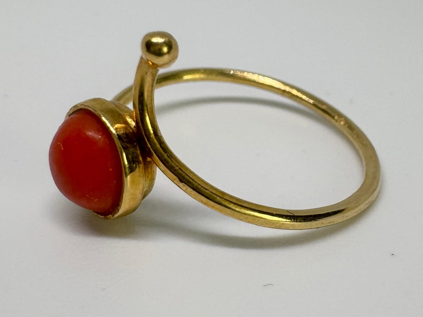 14K gold ring set with a round Coral