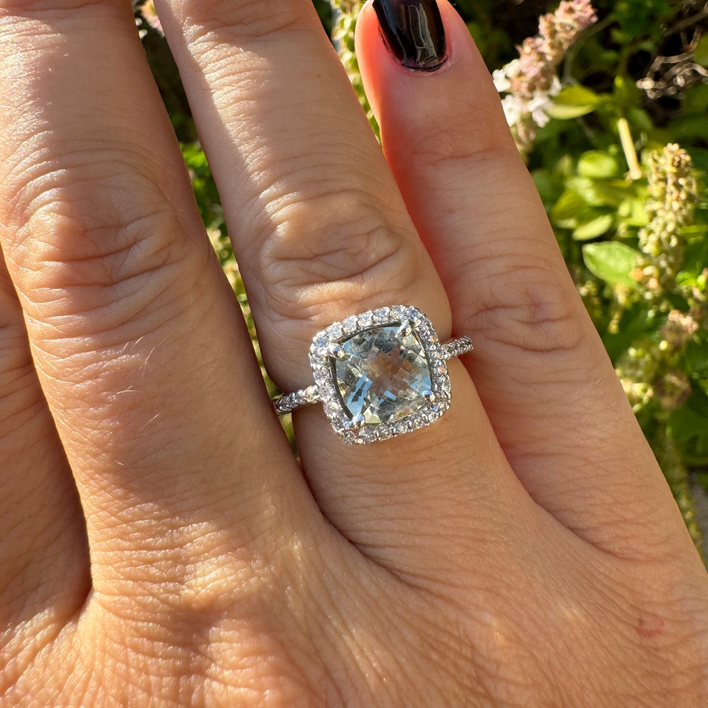 14K white gold ring set with a large prasiolite center stone & diamonds.