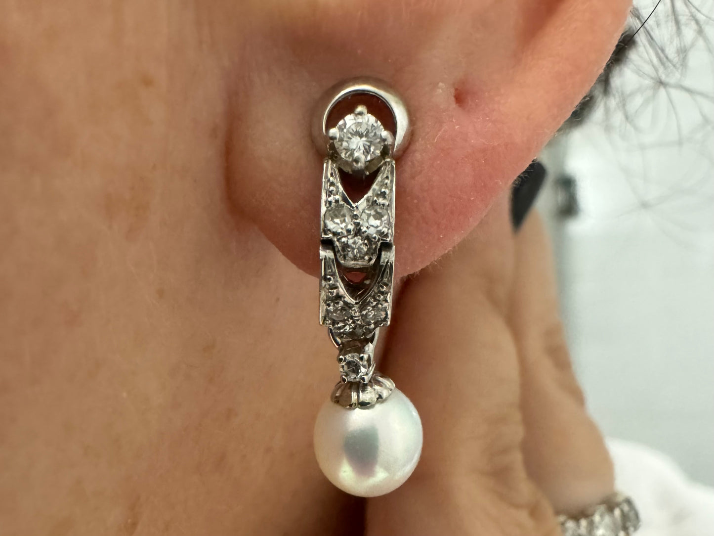 14K gold drop earrings set with Diamonds and a dangling Pearl.