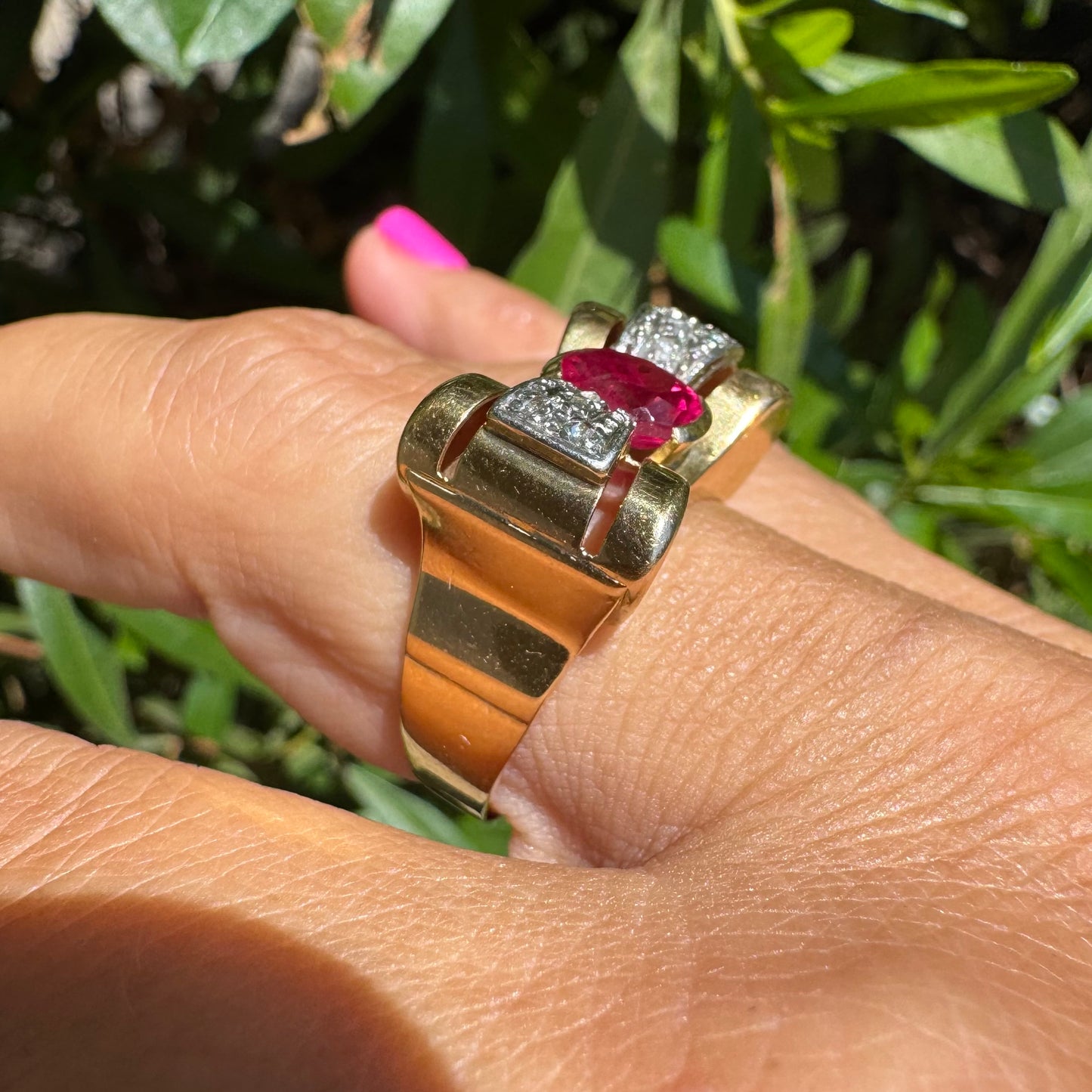 18K gold ring in a sculptural bow-inspired design.
Set with a vivid oval-cut Ruby at the center, framed by shimmering Diamonds