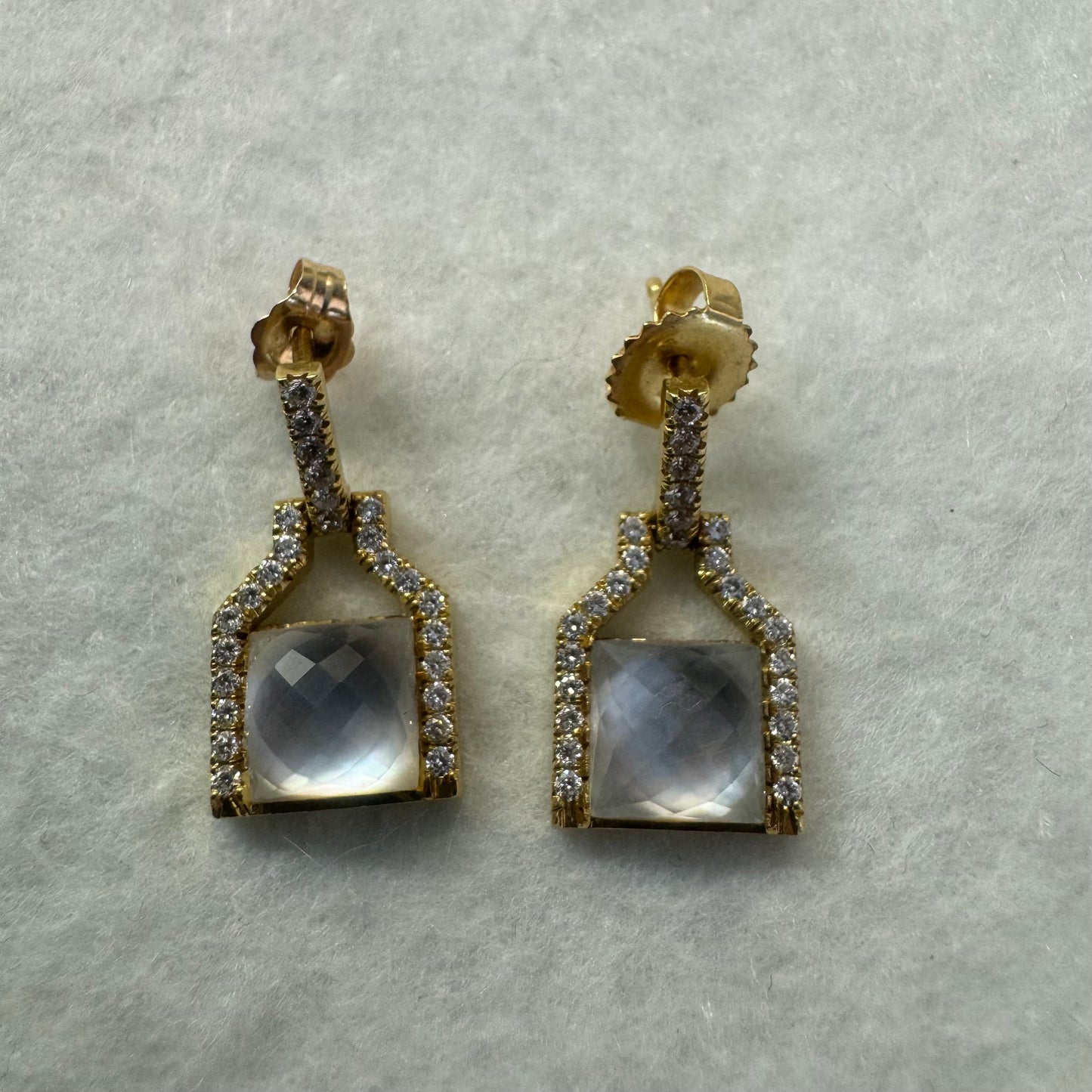 18K gold earrings featuring a cushion-cut translucent Gemstone, framed with sparkling Diamonds