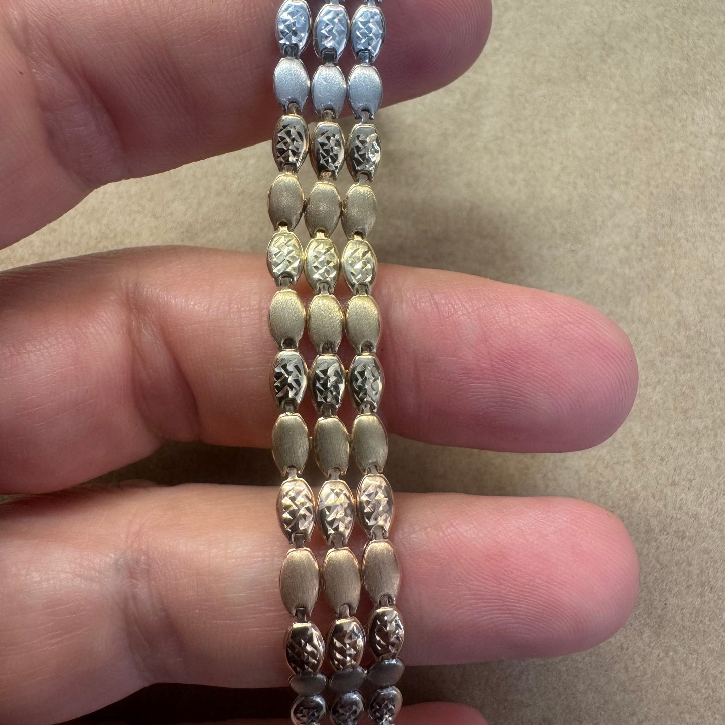 14K tri-color gold bracelet featuring yellow, white and rose gold links