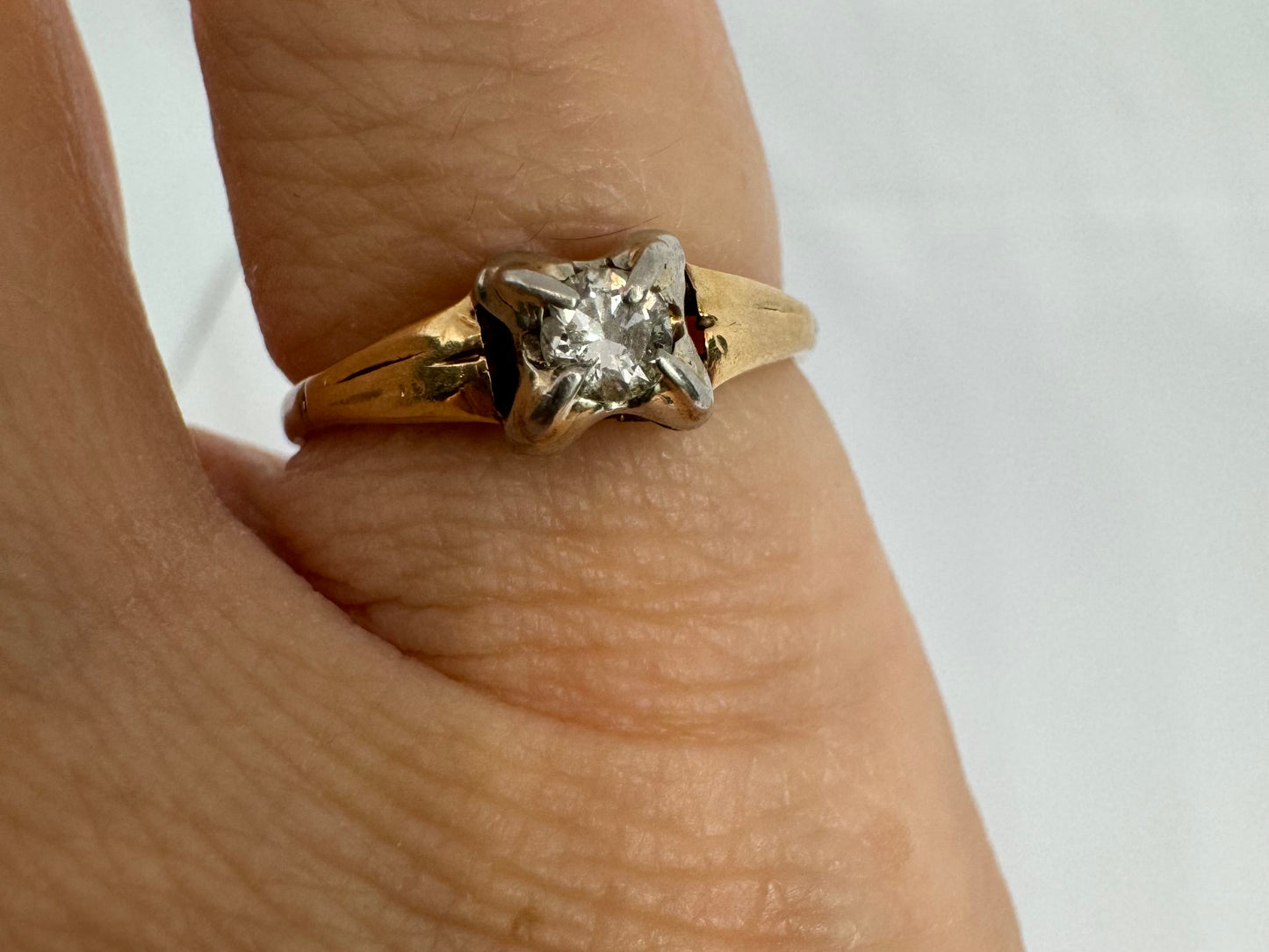 14K gold ring set with one center Diamond