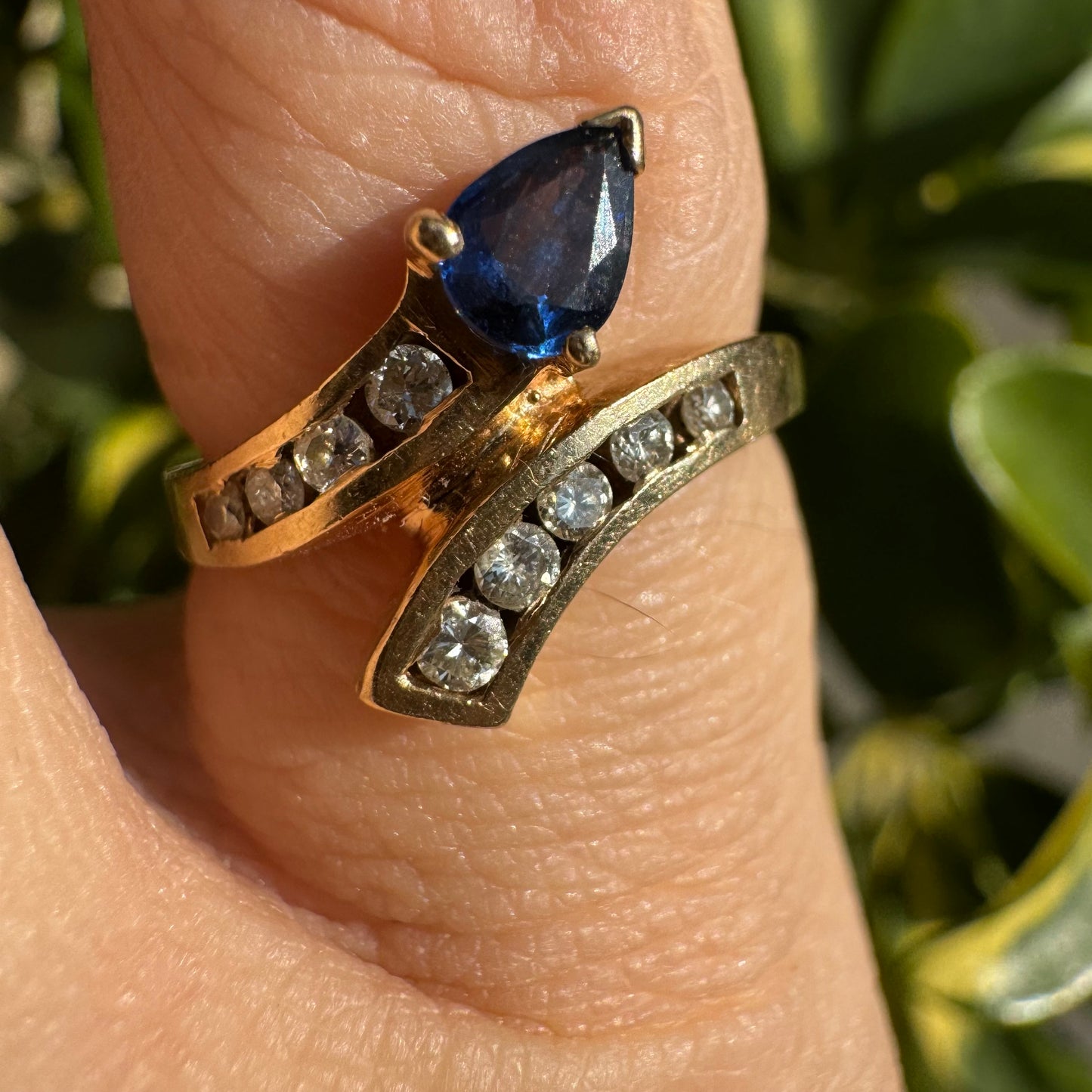 14K gold ring set with a teardrop-shaped Sapphire & Diamonds