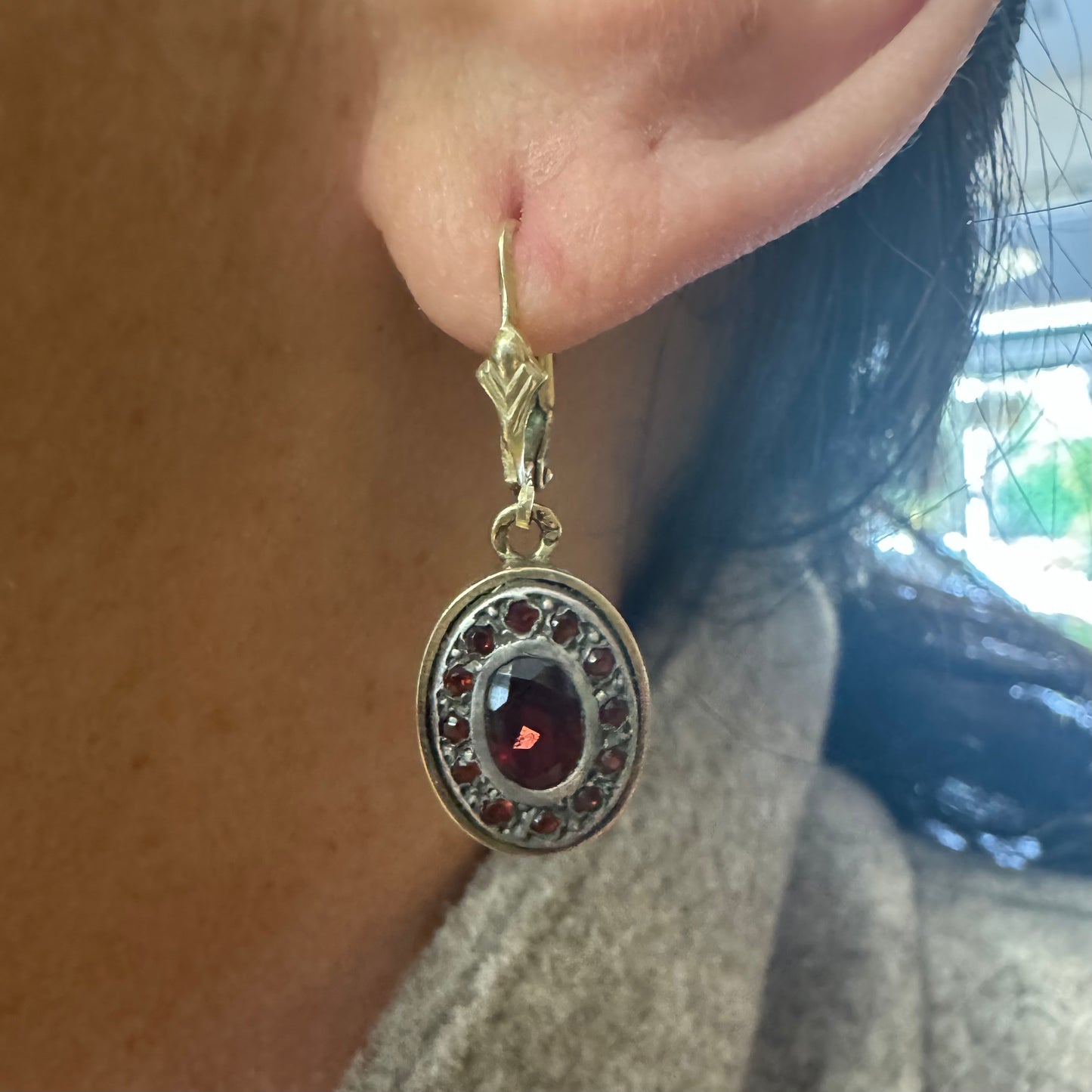 14K gold drop earrings set with deep red oval Garnets surrounded by smaller stones Garnets.
