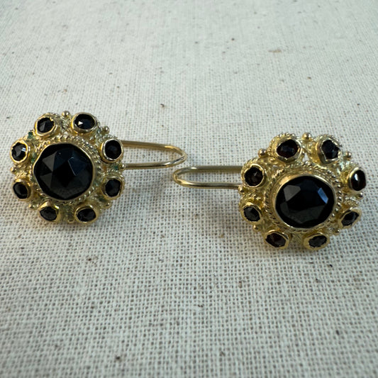 14K gold drop earrings set with deep red Garnets arranged in a bold circular design