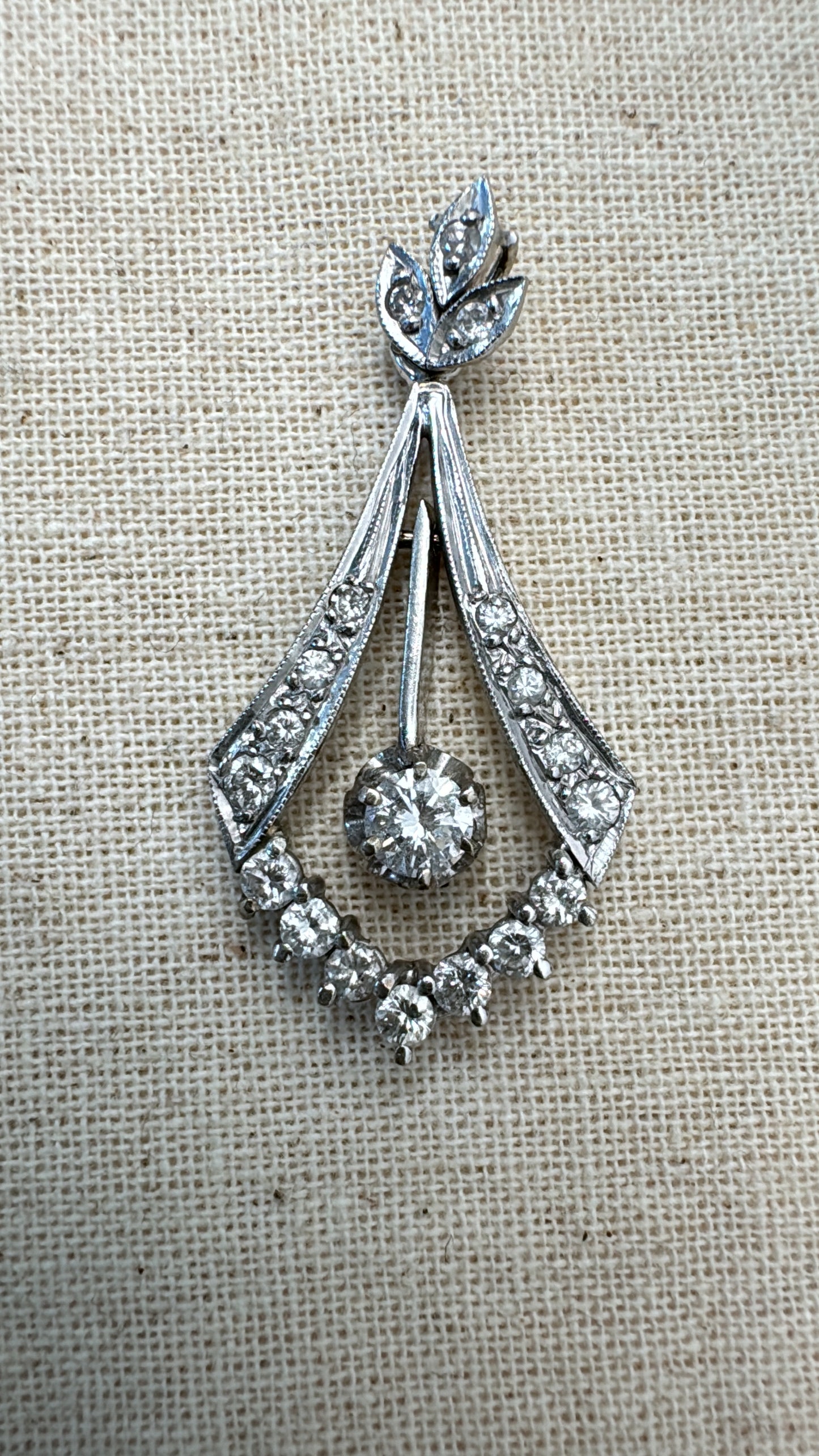 14K gold Diamond pendant with a timeless silhouette and a subtle Art-Deco touch.