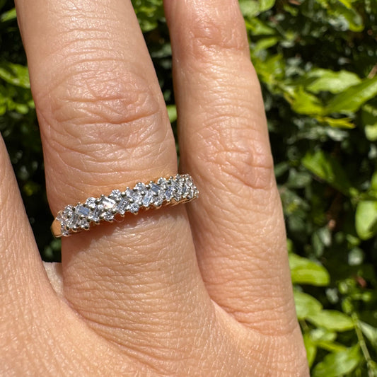 14K gold ring set with a mix of round and baguette-cut Diamonds