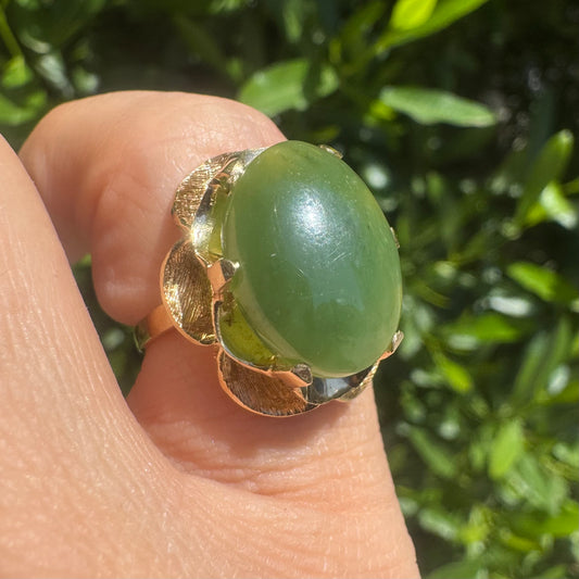 14K gold ring set with a large green Jade cabochon
