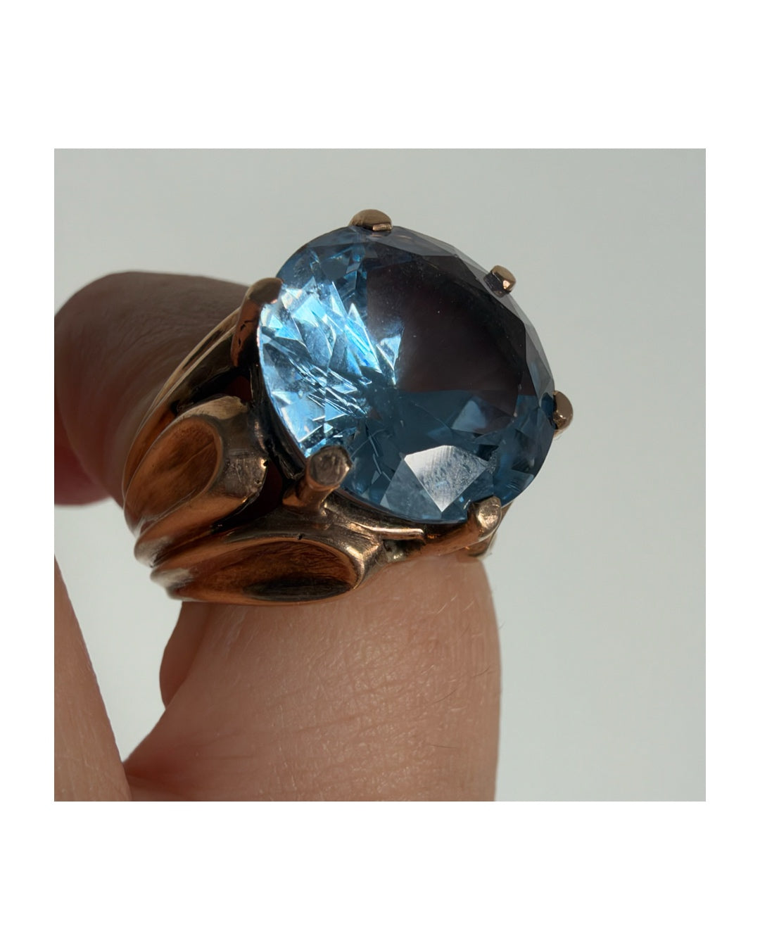9K gold vintage ring with a large faceted blue topaz