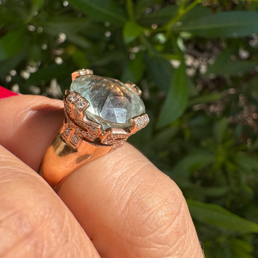 18K gold ring set with a large round Prasiolite gemstone accented by small Diamonds