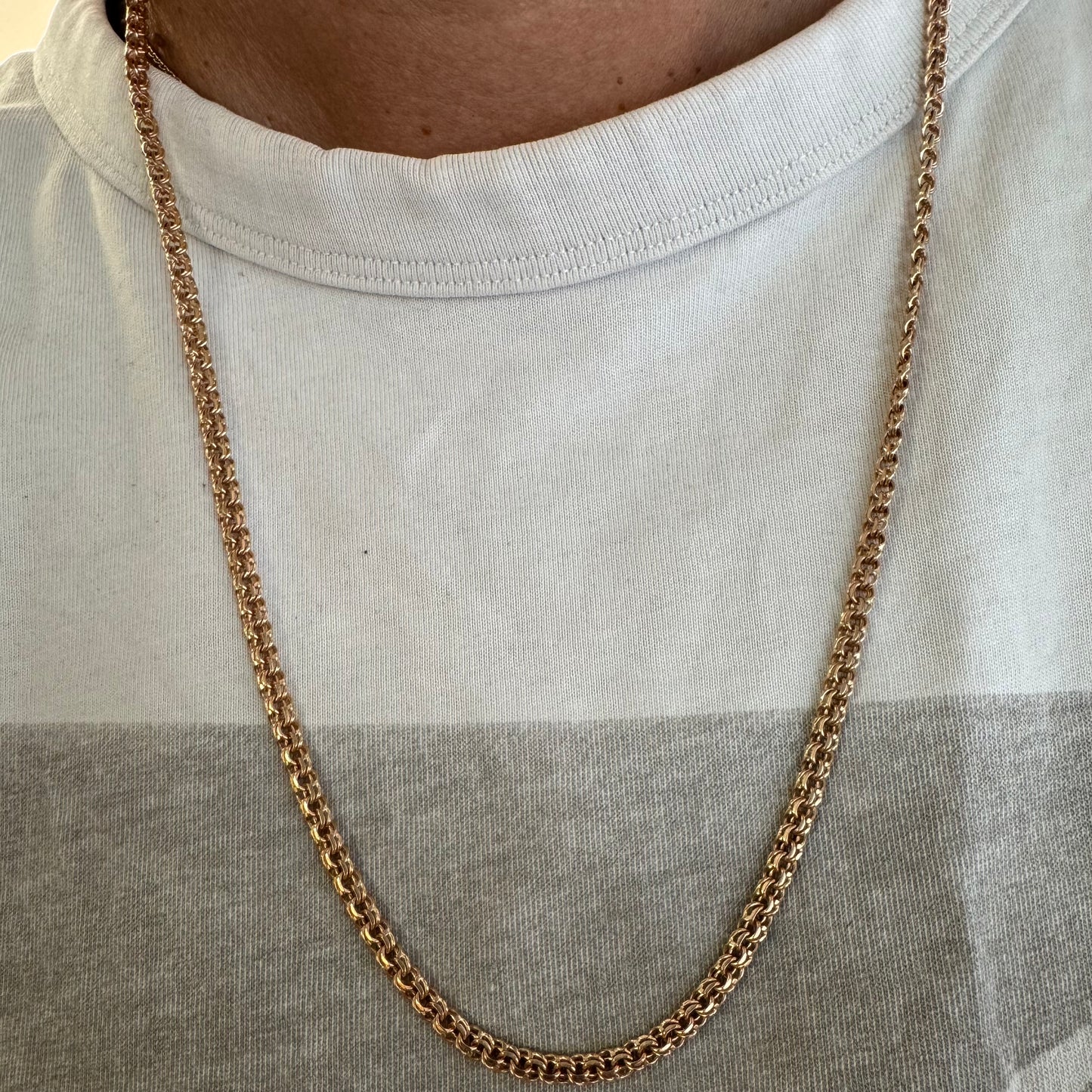 14K gold chain featuring an intricate woven link
