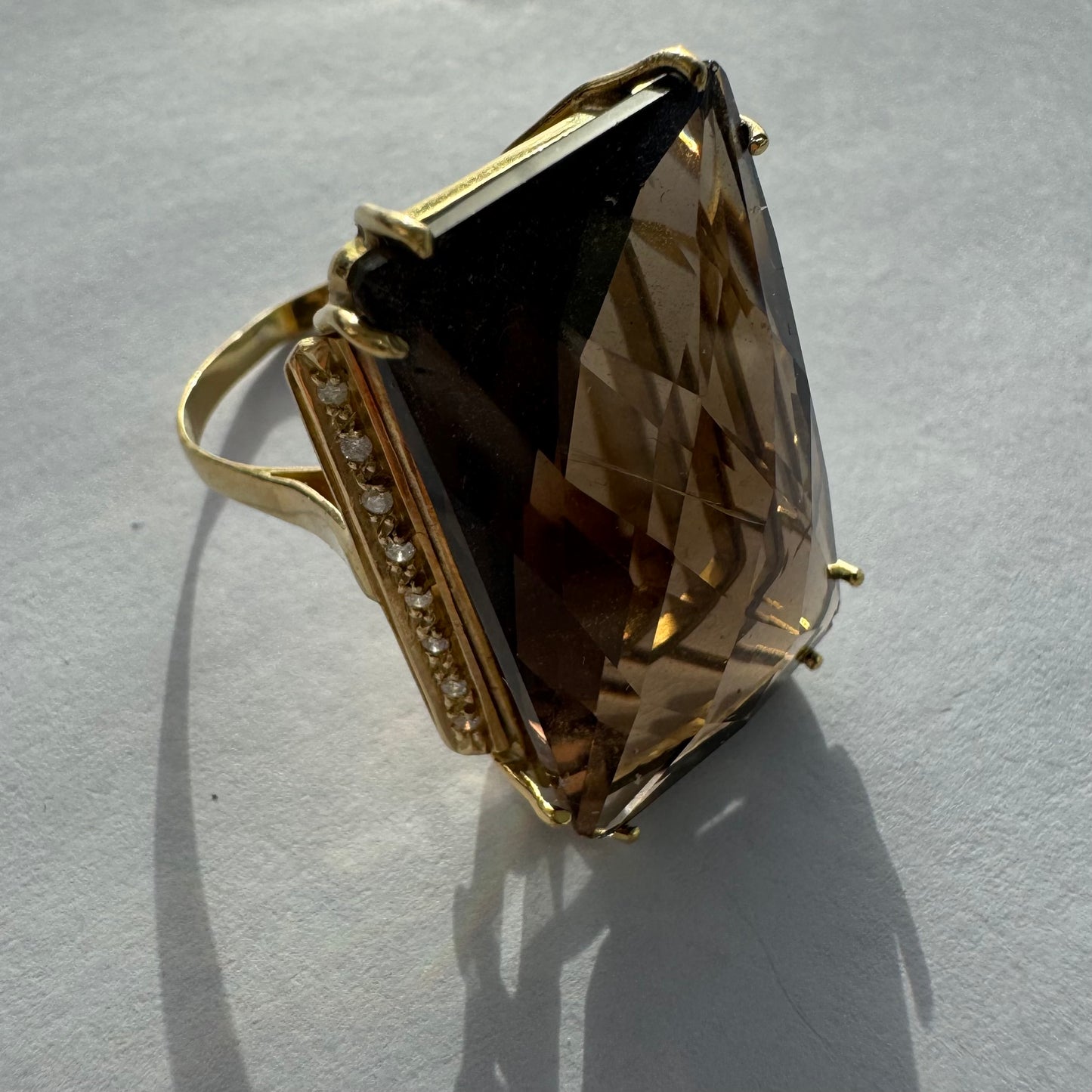 18K gold statement ring set with an oversized rectangular faceted Smoky Quartz center stone & Diamonds