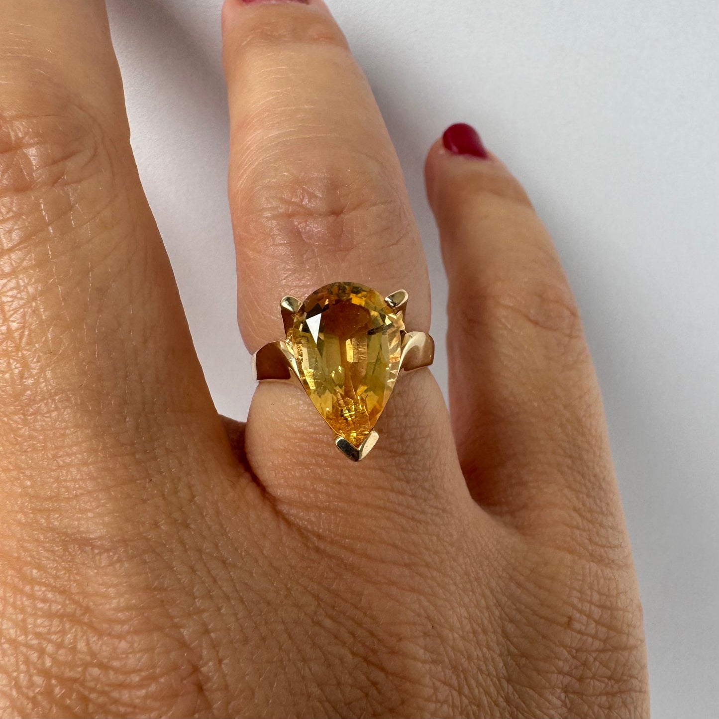14K gold ring set with a large pear-shaped Citrine