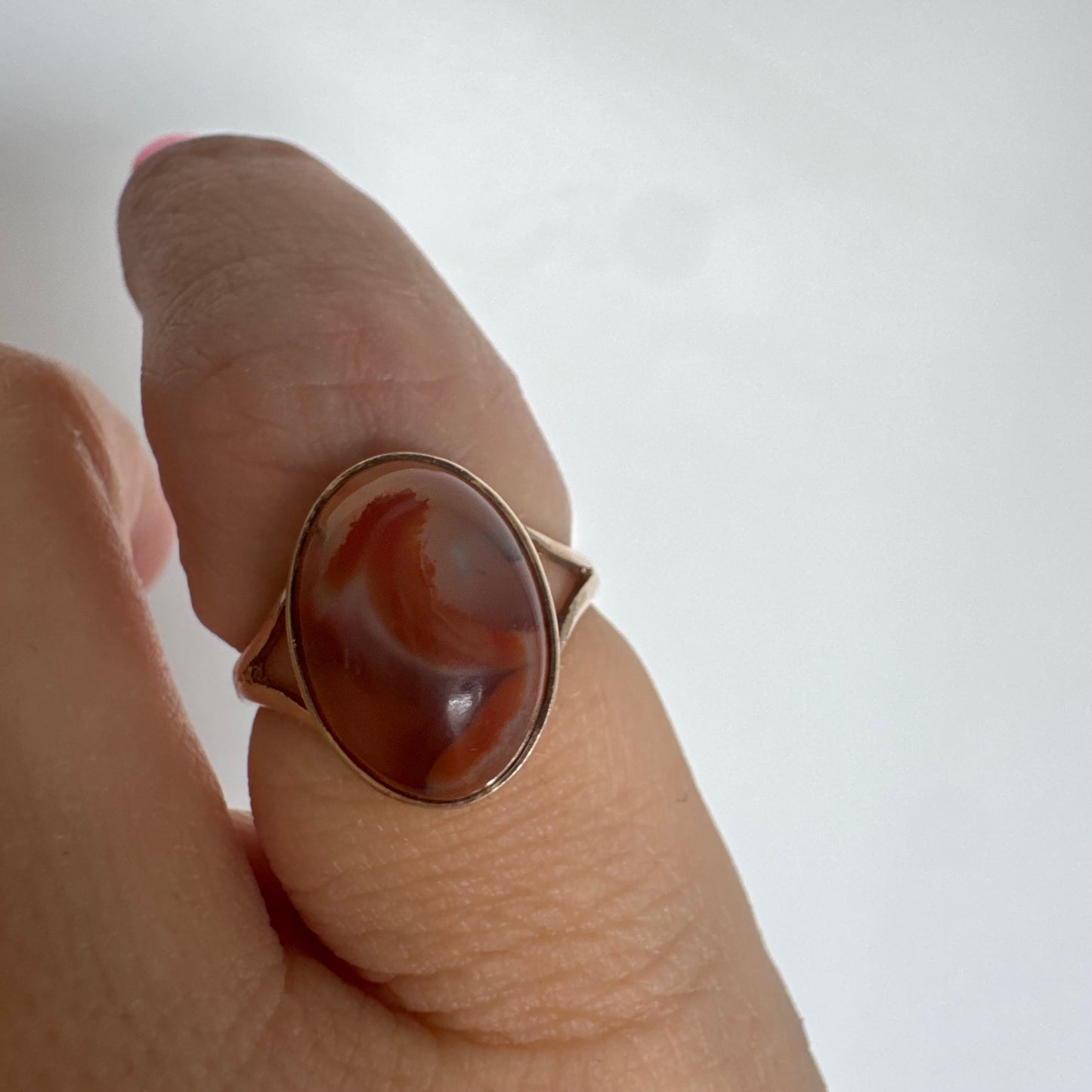 9K gold ring set with a warm reddish-brown stone featuring beautiful natural patterns