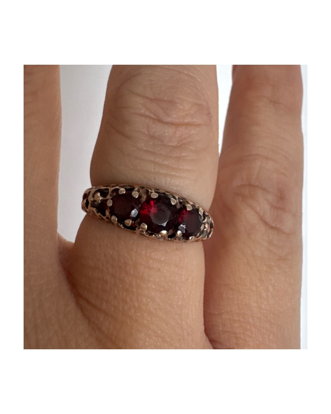 9K gold ring set with deep red Garnet stones